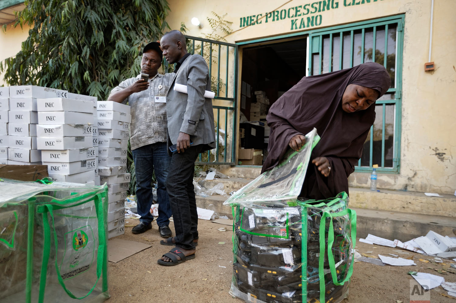 An electoral worker prepares identity card and biometric verification readers, at the offices of the Independent National Electoral Commission in Kano, northern Nigeria, Feb. 14, 2019. (AP Photo/Ben Curtis)