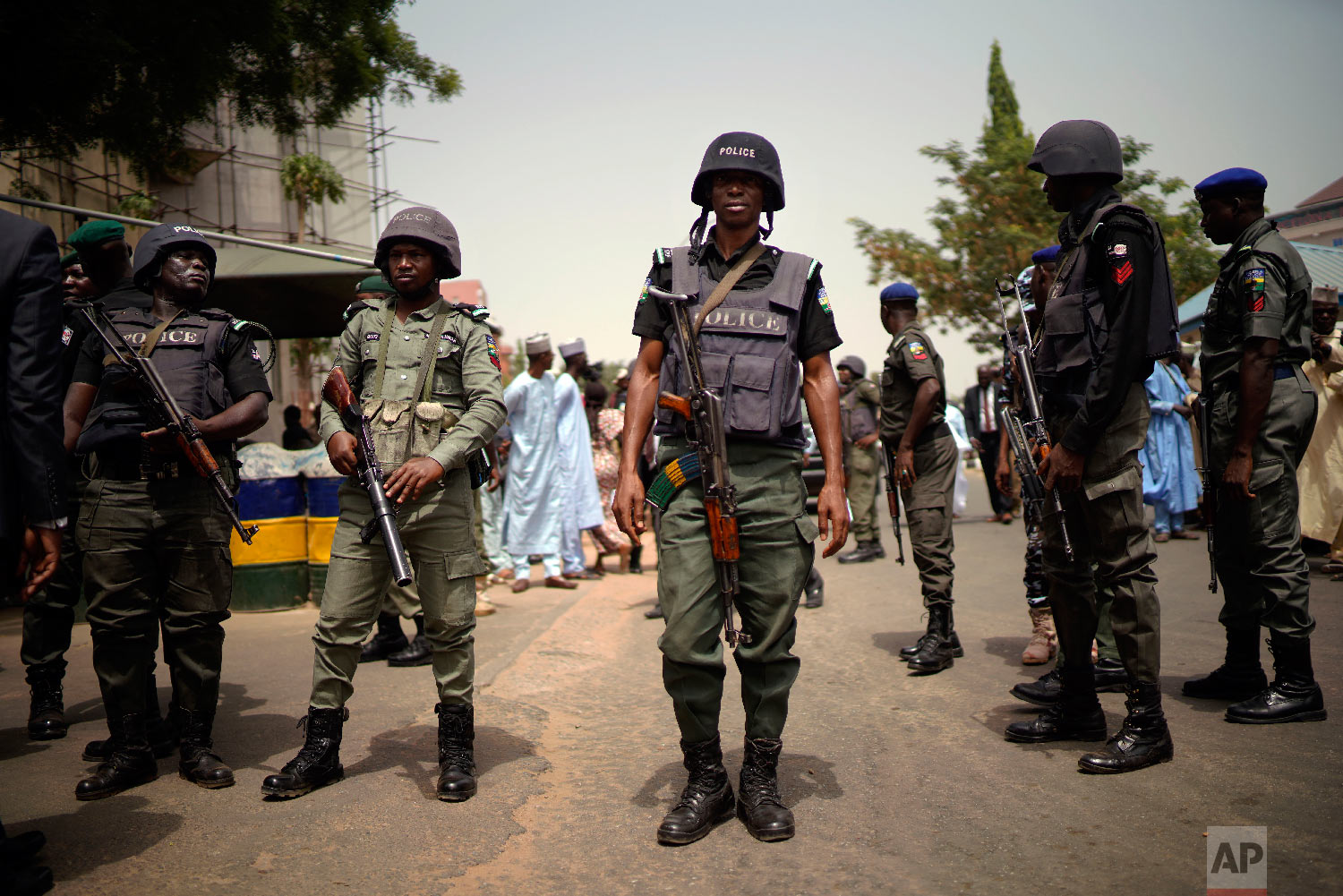 Nigerian police guard the entrance of the All Progressives Congress (APC) party headquarters where Incumbent President Muhammadu Buhari holds an emergency meeting with senior members of the party in Abuja, Nigeria, Feb. 18, 2019. (AP Photo/Jerome Delay)