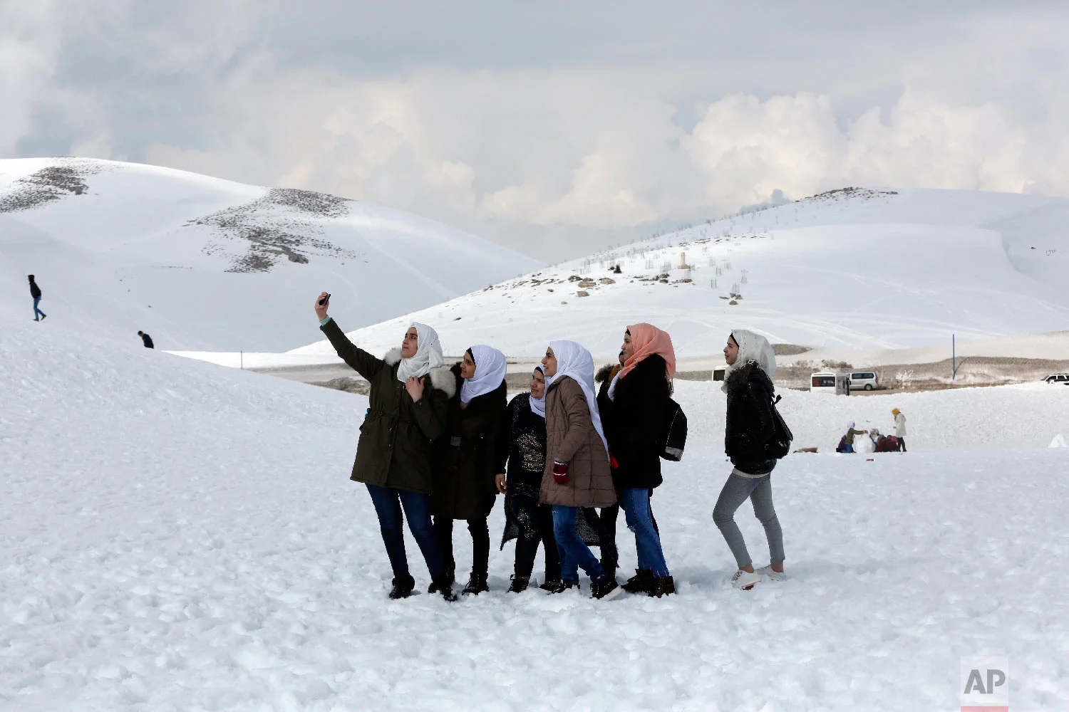  Syrian girls take a selfie at the Faraya-Mzaar ski resort, in Faraya, northeast of Beirut, Lebanon, Feb. 22, 2019. (AP Photo/Bilal Hussein) 