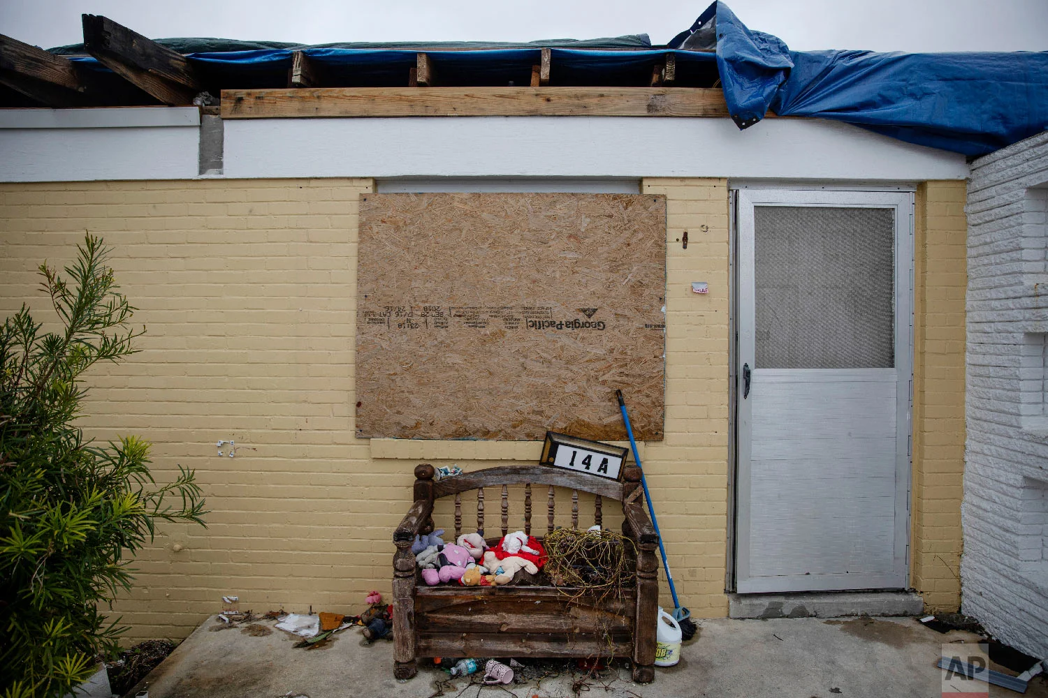 Stuffed animals sit outside a boarded up housing development damaged from Hurricane Michael in Panama City, Fla, Thursday, Jan. 24, 2019. (AP Photo/David Goldman)