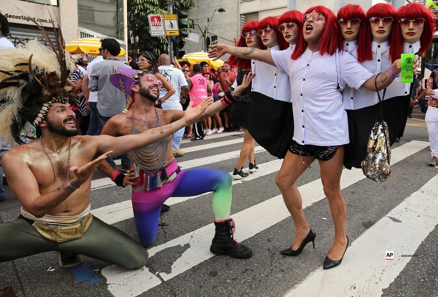 Carnival revelers perform during the Academicos do Baixo Augustaa carnival "bloco" parade in Sao Paulo, Brazil, Sunday, Feb. 24, 2019. (AP Photo/Andre Penner)