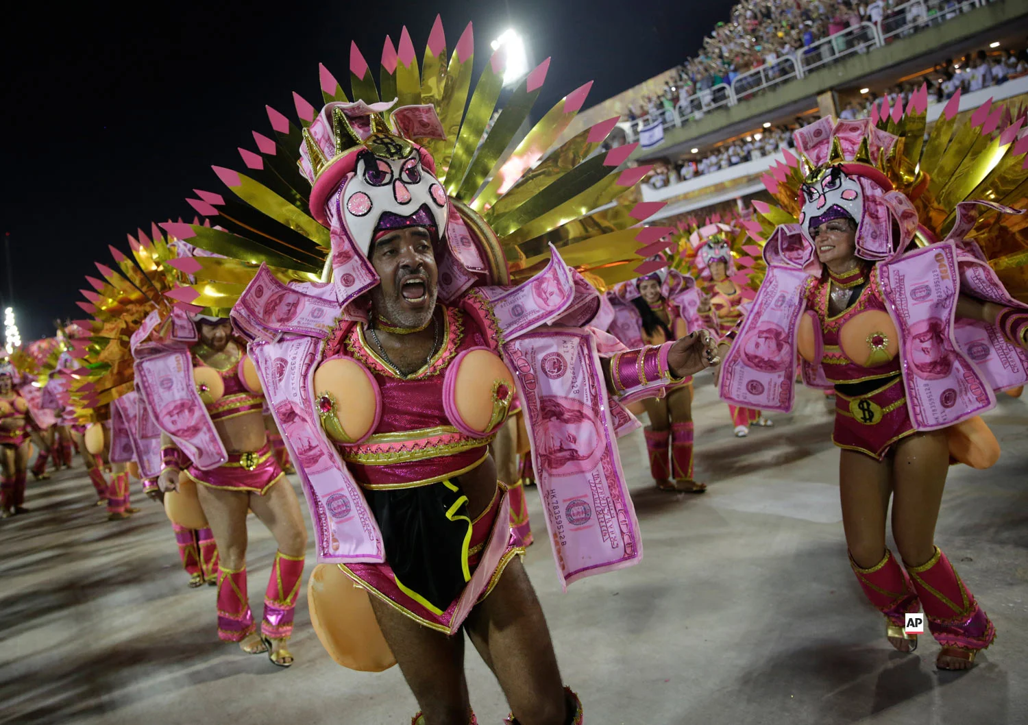Performers from the Sao Clemente samba school parade during Carnival celebrations at the Sambadrome in Rio de Janeiro, Brazil, Monday, March 4, 2019. (AP Photo/Silvia Izquierdo)