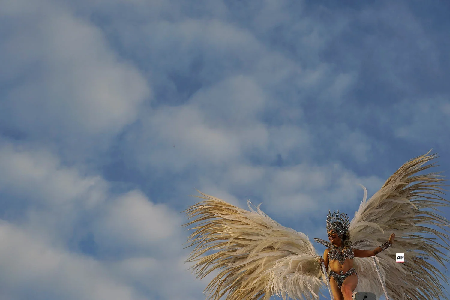 A performer from the Mocidade samba school parades on a float during Carnival celebrations at the Sambadrome in Rio de Janeiro, Brazil, Tuesday, March 5, 2019. (AP Photo/Leo Correa)