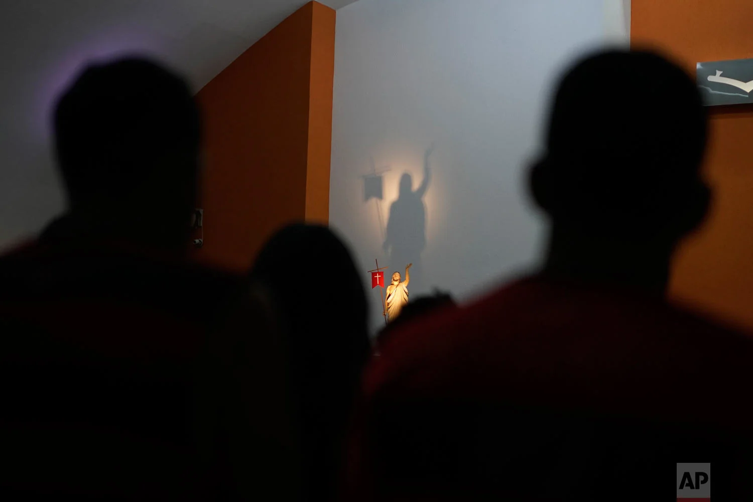 People attend a memorial Mass for the 10 teenage victims of a fire at a Brazilian soccer academy, in Rio de Janeiro, Brazil, Feb. 8, 2019. (AP Photo/Leo Correa)