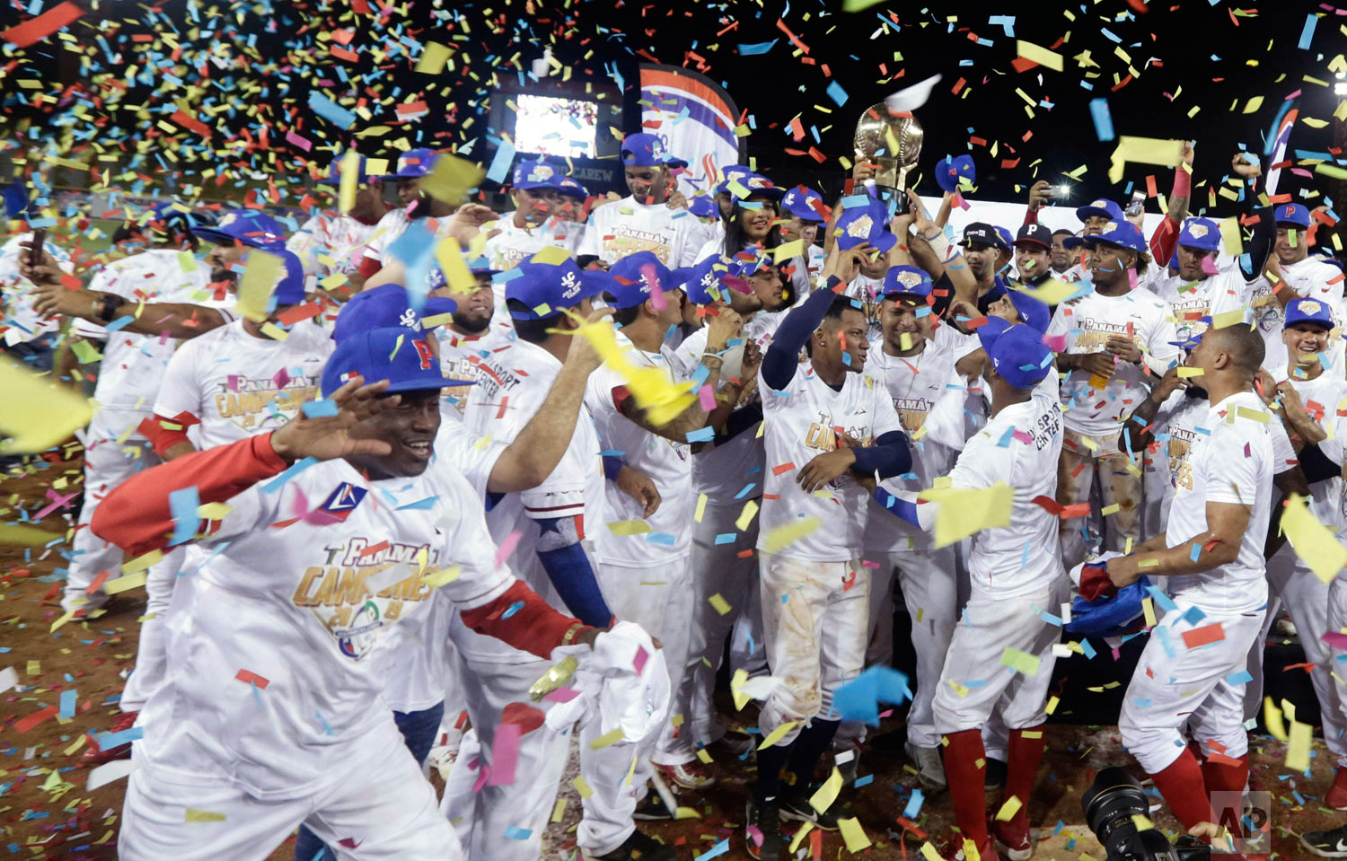 Panama's Los Toros de Herrera baseball players celebrate their 3-0 victory over Cuba's Los Leneros de las Tunas amid confetti at the end of the Caribbean Series baseball tournament's final, championship game at Rod Carew stadium in Panama City, Feb. 10, 2019. (AP Photo/Arnulfo Franco)