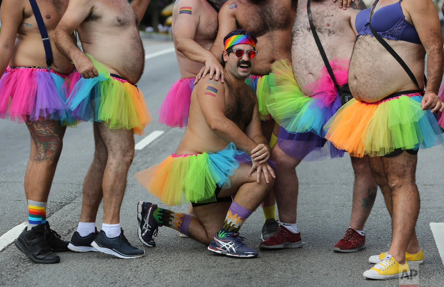 Carnival revelers pose for a picture during the Academicos do Baixo Augusta carnival "bloco" parade in Sao Paulo, Brazil, Feb. 24, 2019. (AP Photo/Andre Penner)
