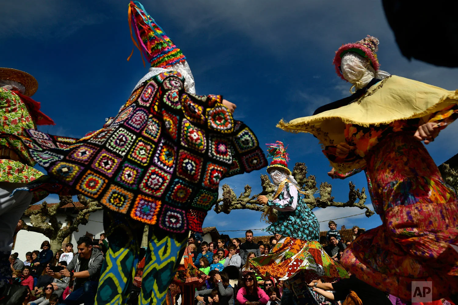''Txatxus'' dance during ancient rural carnival in the small Pyrenees village of Lantz, northern Spain, Sunday, March 3, 2019. The carnival is a long-standing rural tradition in which the forces of good and evil confront each other in a symbolic battle. (AP Photo/Alvaro Barrientos)