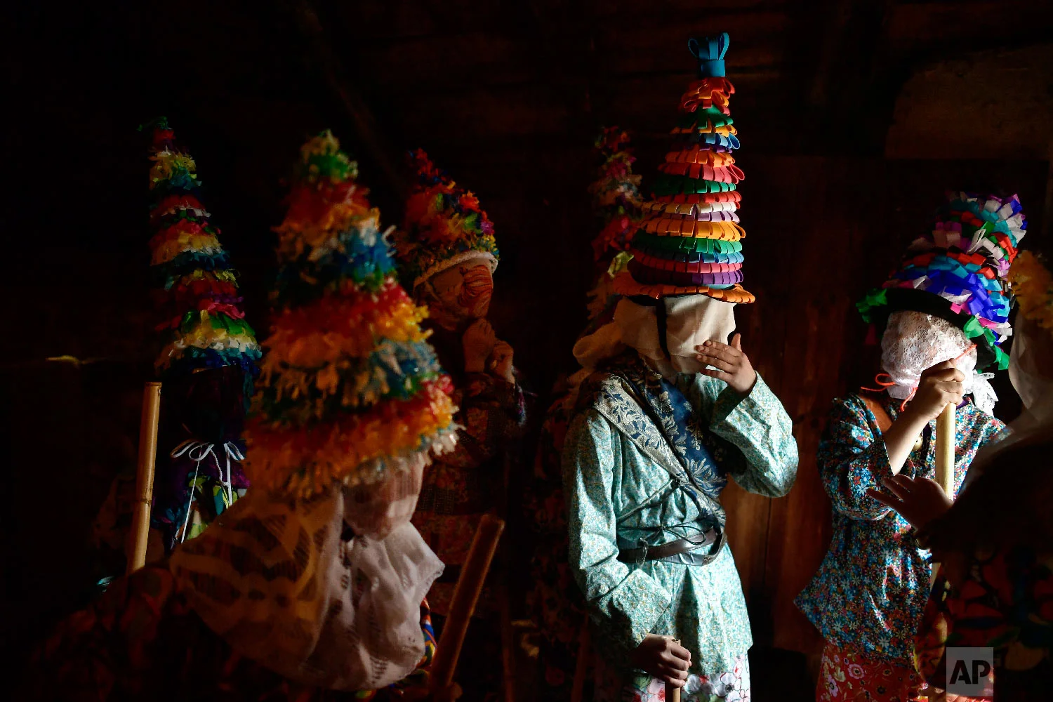 People prepare to takes part in ancient rural carnival in the small Pyrenees village of Lantz, northern Spain, Sunday, March 3, 2019. The carnival is a long-standing rural tradition in which the forces of good and evil confront each other in a symbolic battle. (AP Photo/Alvaro Barrientos)