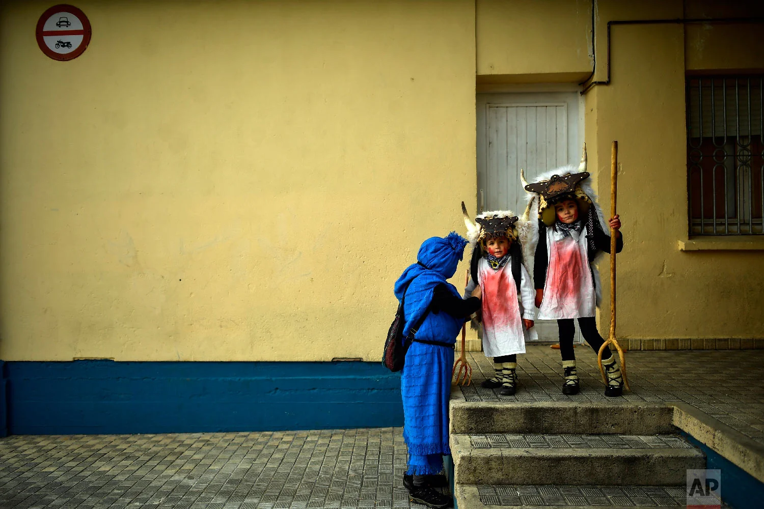 Young "Momotxorros " prepare to take part in the carnival wearing typical carnival dress, in Alsasua, northern Spain, Tuesday, March 5, 2019. (AP Photo/Alvaro Barrientos)
