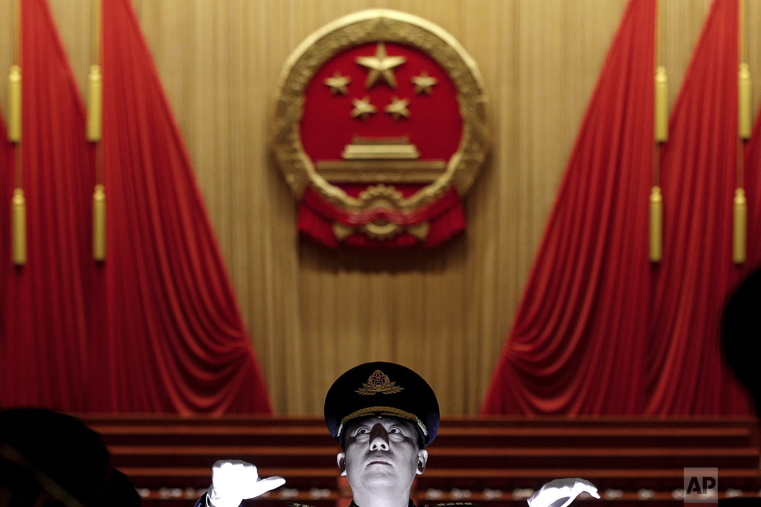  A military conductor leads band members during a rehearsal for the opening session of the China's National People's Congress at the Great Hall of the People in Beijing, Tuesday, March 5, 2019. (AP Photo/Andy Wong) 