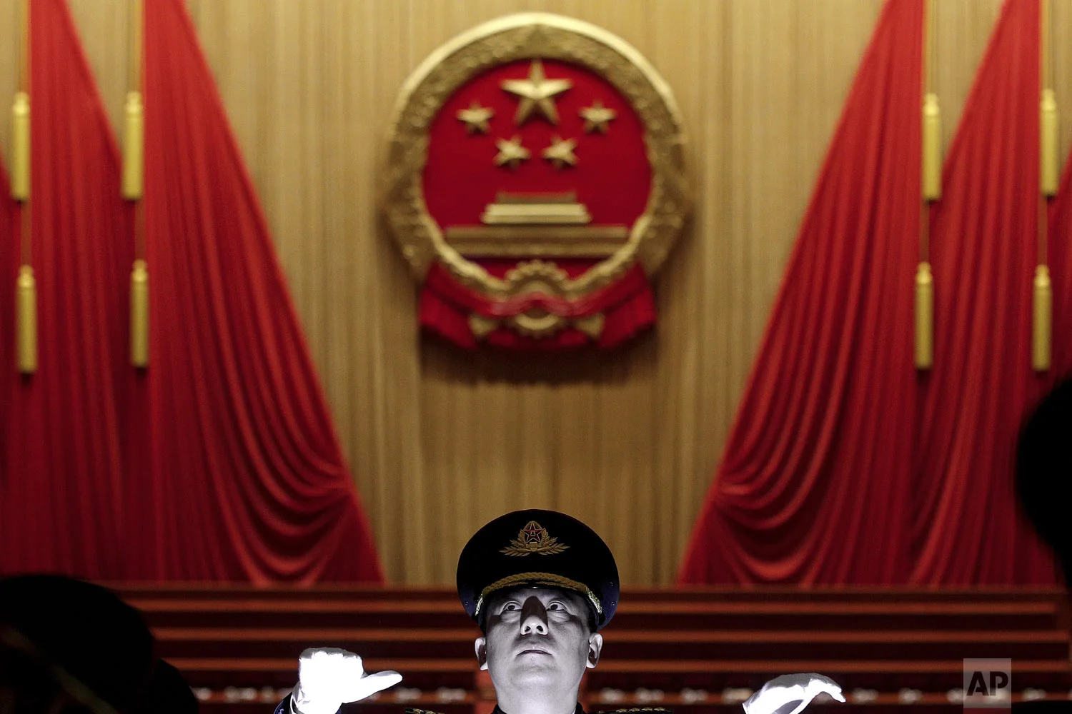 A military conductor leads band members during a rehearsal for the opening session of the China's National People's Congress at the Great Hall of the People in Beijing, Tuesday, March 5, 2019. (AP Photo/Andy Wong)