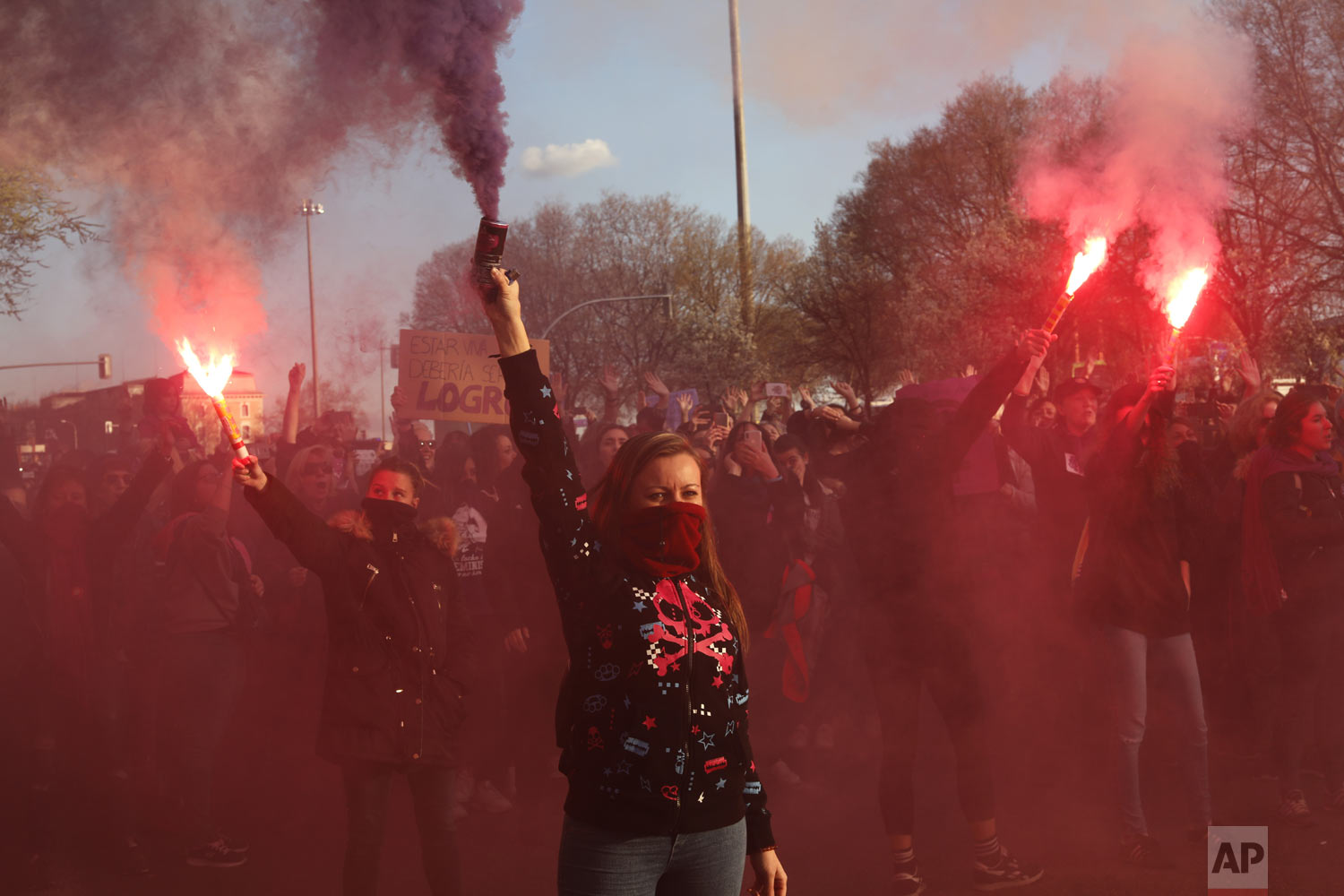  Women hold flares during a march for International Women's Day in Madrid, Spain, Friday, March 8, 2019. Marches and protests are held Friday across the globe to mark International Women's Day under the slogan #BalanceforBetter, with calls for a more