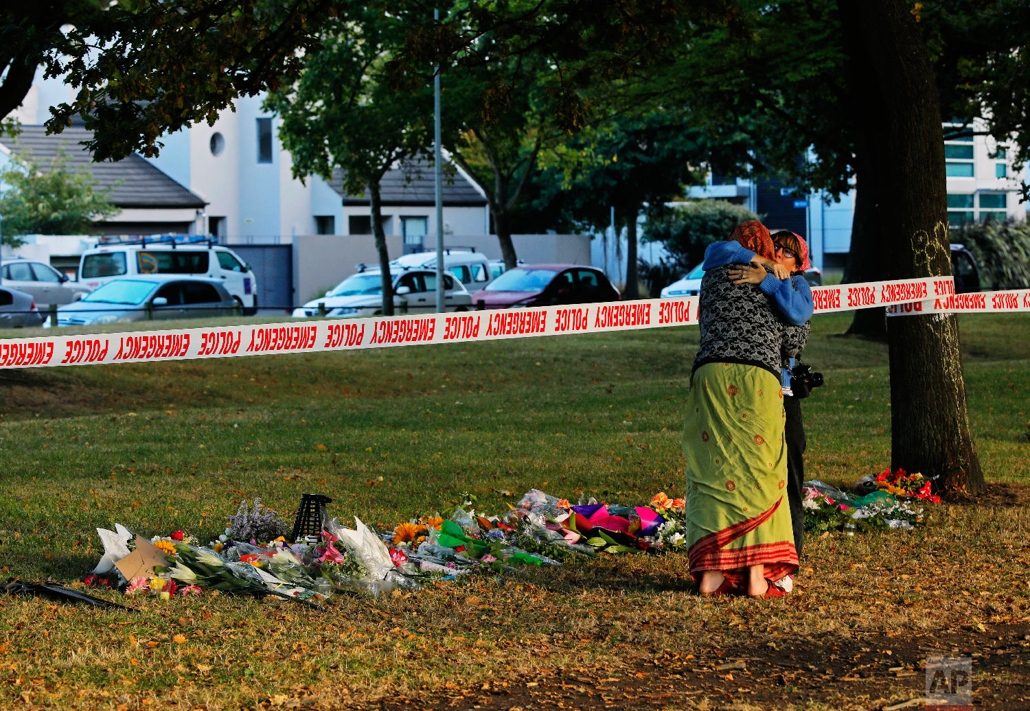 Mourners huge in front of the Masjid Al Noor mosque in Christchurch, New Zealand, Sunday, March 17, 2019, where one of the two mass shootings occurred. (AP Photo/Vincent Yu)