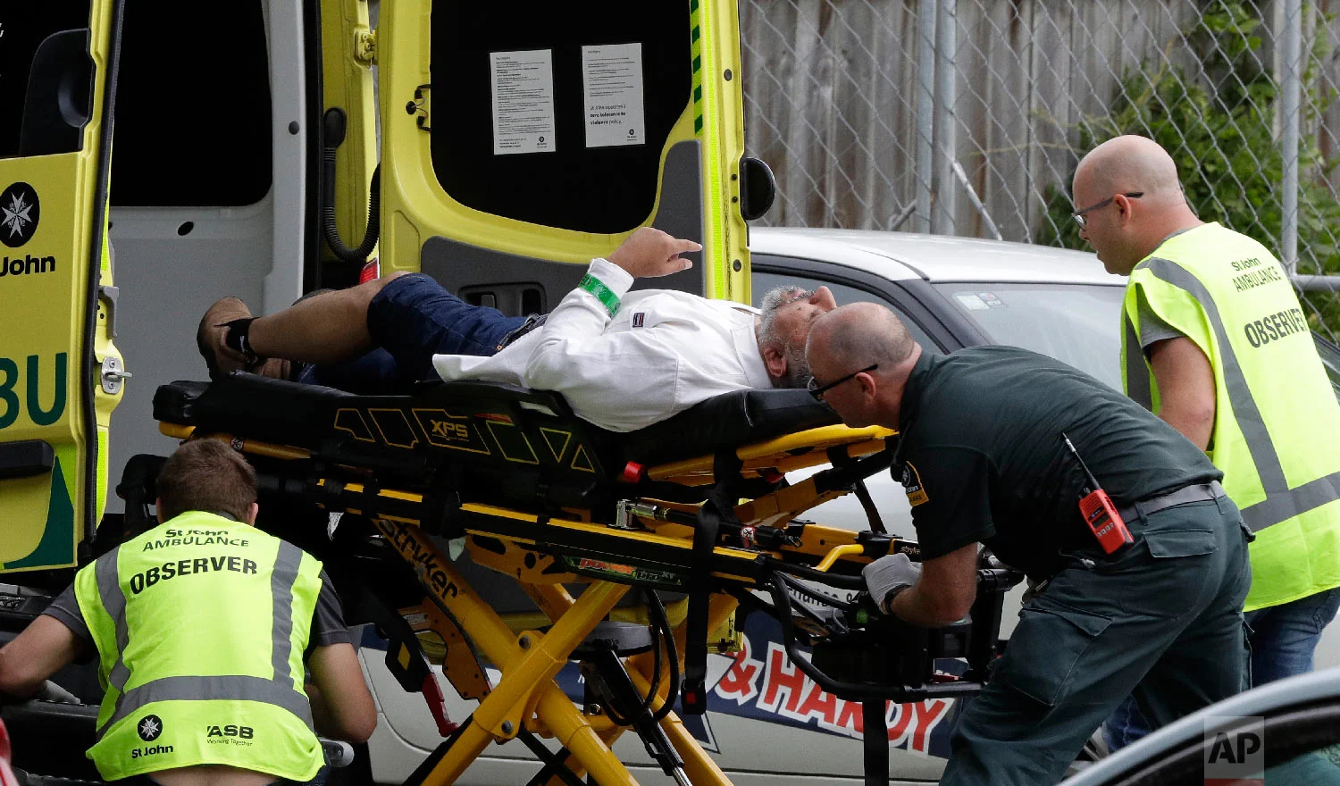 Ambulance staff take a man from outside a mosque in central Christchurch, New Zealand, Friday, March 15, 2019. (AP Photo/Mark Baker)