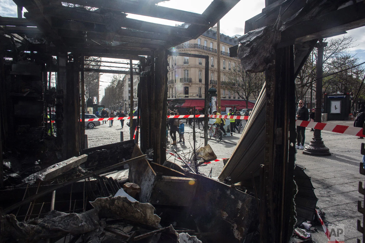 Inside view of the burned out remains of terrasse of the famed restaurant Le Fouquet's on the Champs Elysees the day after it was vandalized and set on fire in Paris, France, March 17, 2019. (AP Photo/Rafael Yaghobzadeh)