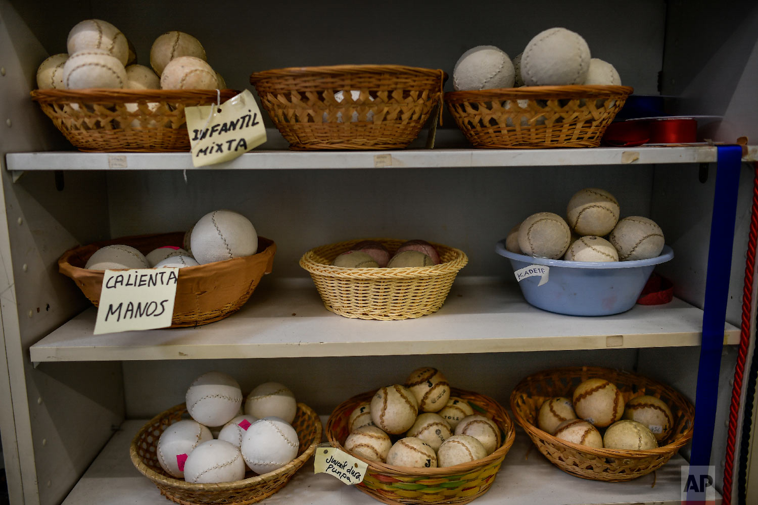 Different models of Basque balls are displayed for sale at a store in Pamplona, northern Spain on Feb. 28, 2019. (AP Photo/Alvaro Barrientos)