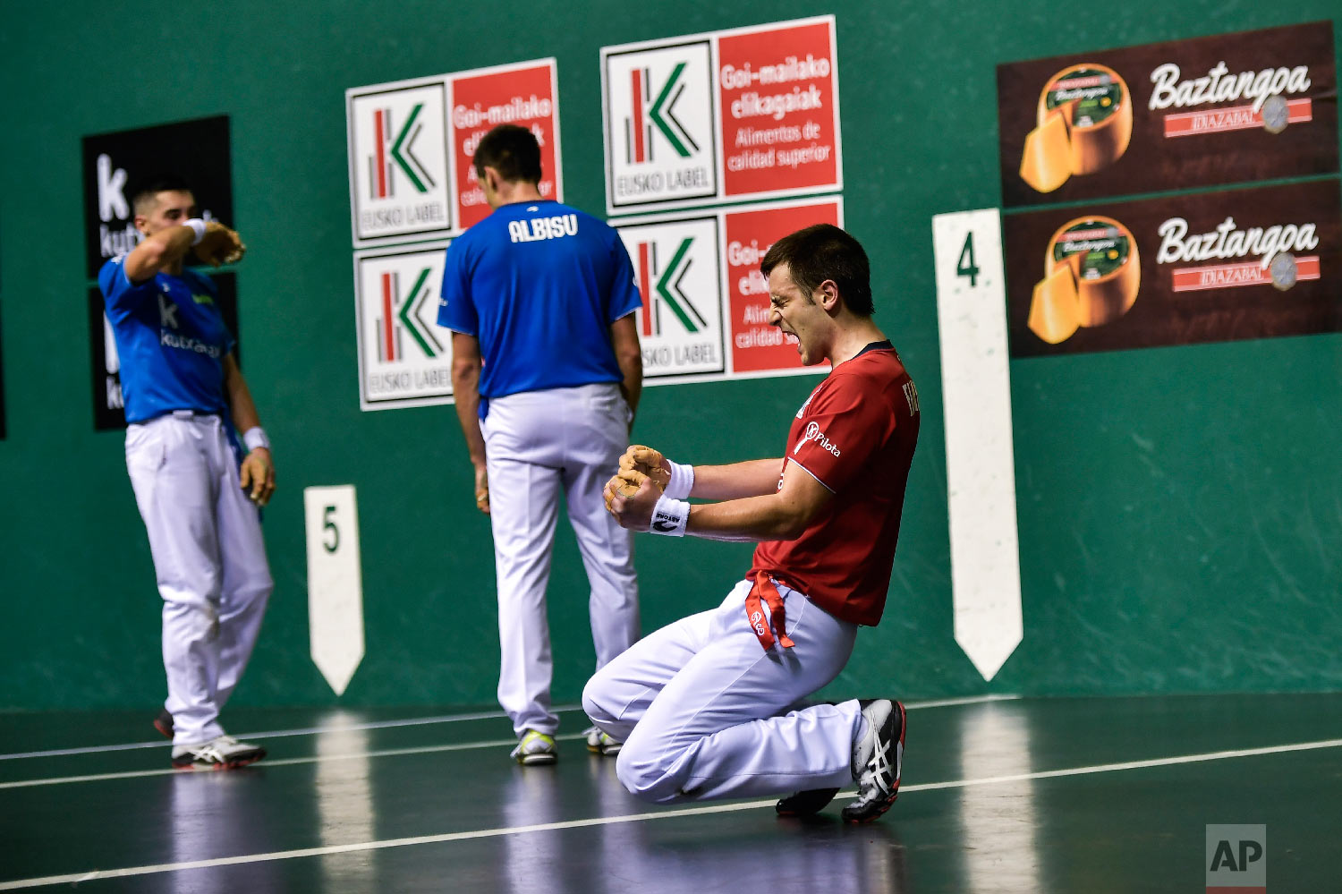 Danel Elezkano, right, celebrates winning the match 22-10 in Pamplona, Spain on March 9, 2019. (AP Photo/Alvaro Barrientos)