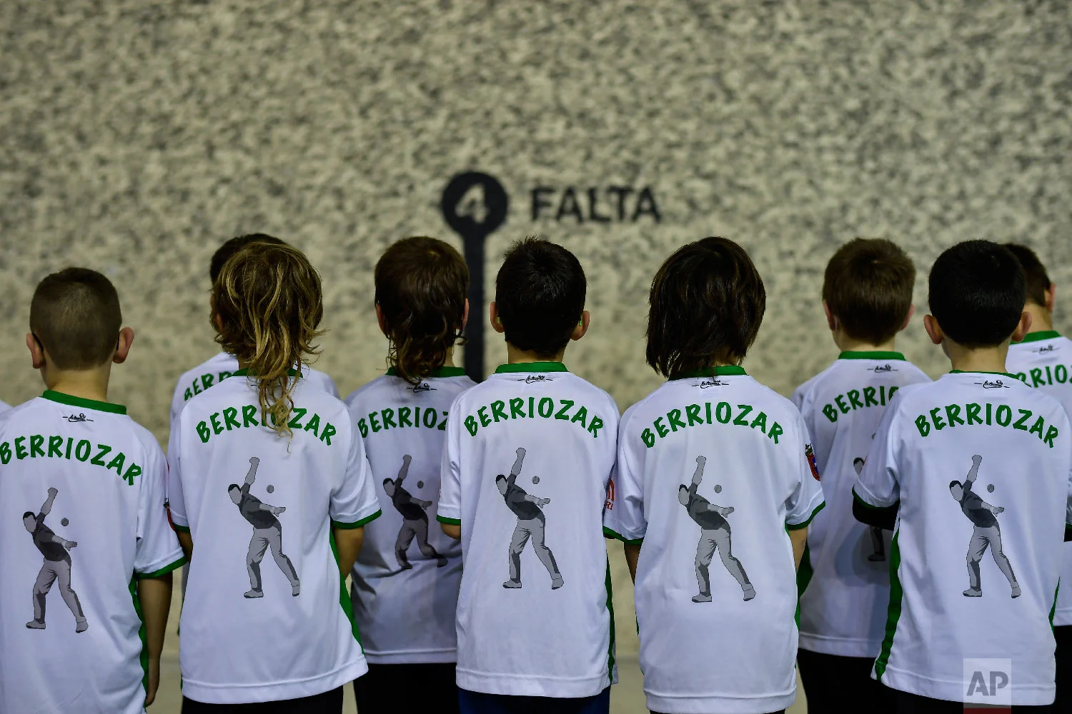 A group of young players of Basque Ball or "pelota vasca" take part in a training session, in Berriozar, near Pamplona, northern Spain on Feb. 28, 2019. (AP Photo/Alvaro Barrientos)