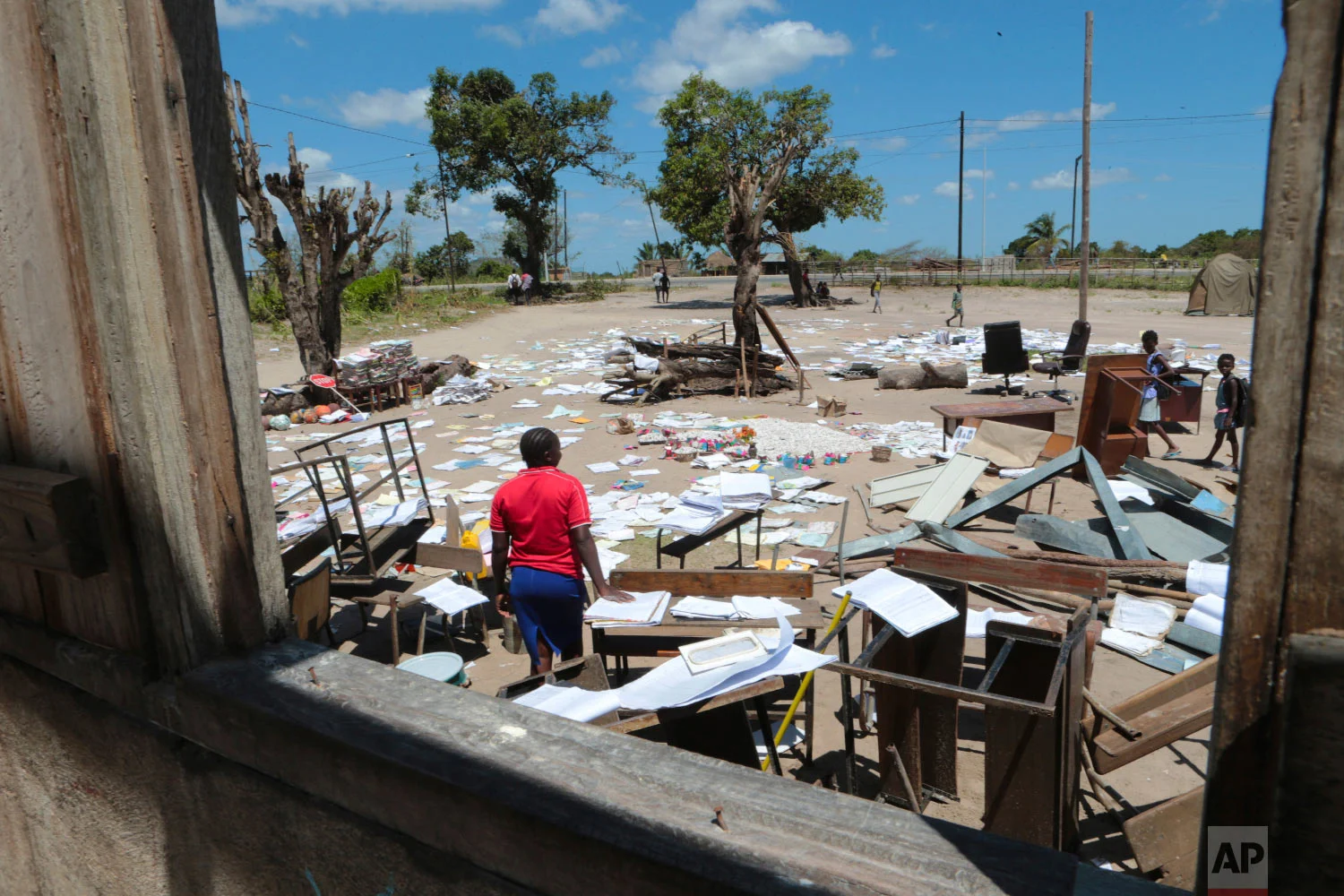 School books at Inchope primary school in Inchope, Mozambique, are left to dry in the sun after the school was damaged by Cyclone Idai, Monday March, 25, 2019. (AP Photo/Tsvangirayi Mukwazhi)