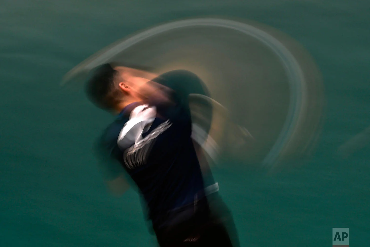 Victor Esteban returns the ball on a Labrit court or fronton, in Pamplona, Spain on Feb. 28, 2019. (AP Photo/Alvaro Barrientos)