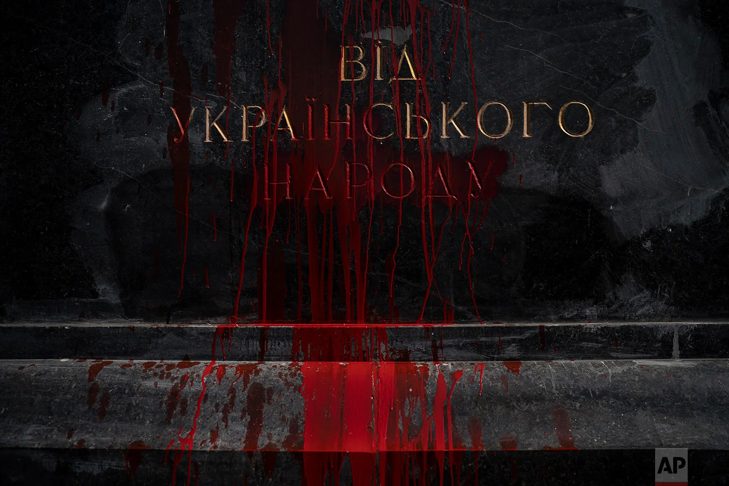 Red paint poured by far right activists run off the Soviet-era monument to Nikolai Vatutin in Kiev, Ukraine, April 13, 2018. (AP Photo/Felipe Dana)