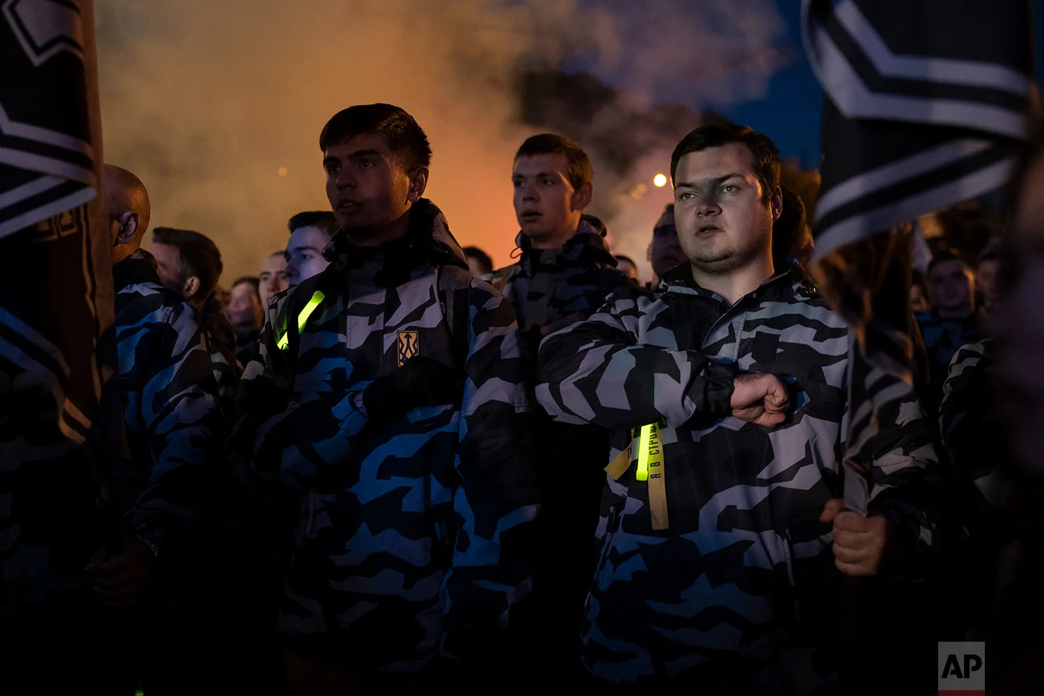 Members of nationalist movements attend a rally marking Defender of Ukraine Day in Kiev, Ukraine, Oct. 14, 2018. (AP Photo/Felipe Dana)
