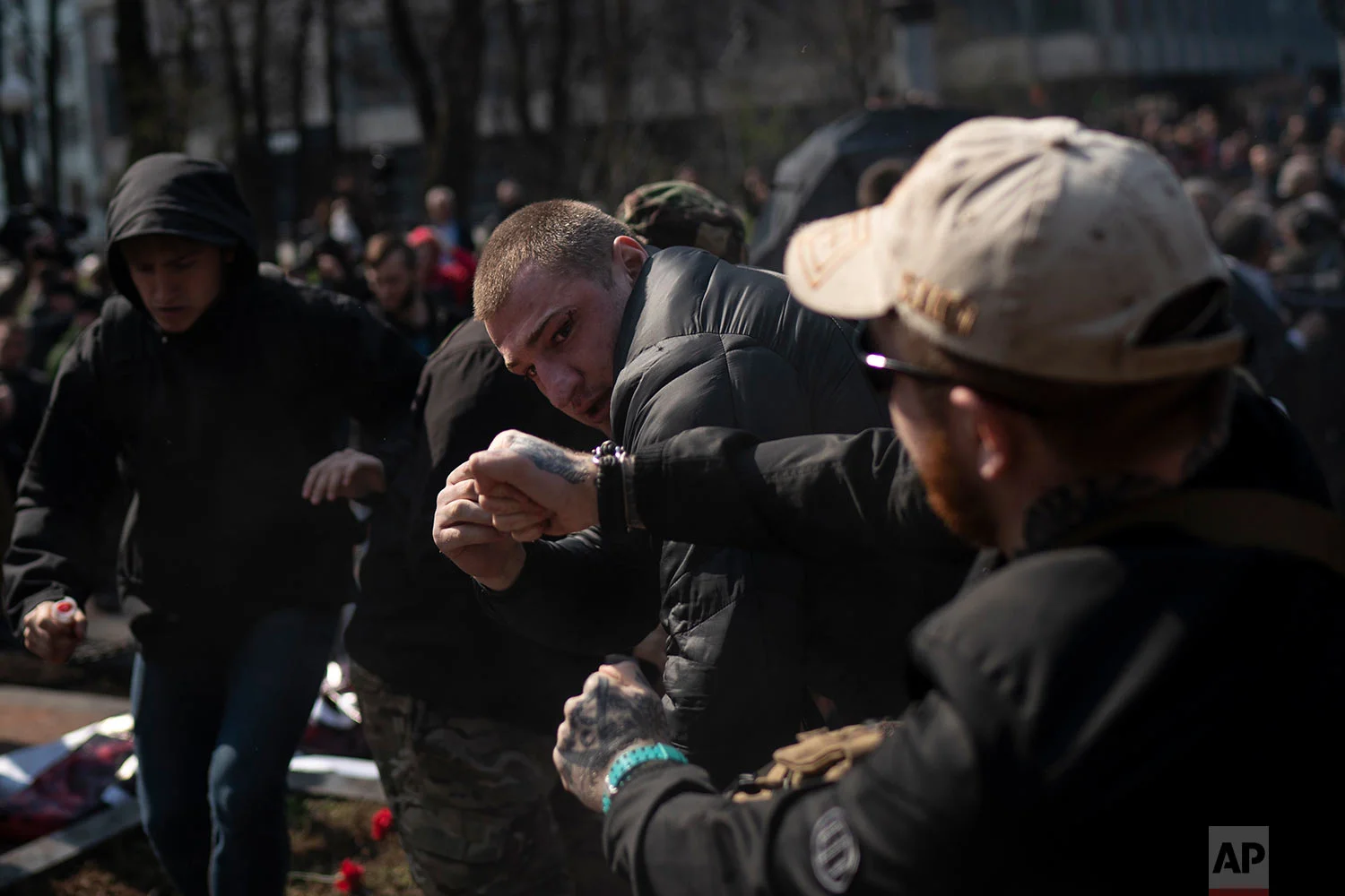 Members of the C14 and other far right organizations fight with pro-Russian supporters at the Soviet-era monument to General Nikolai Vatutin in Kiev, Ukraine, April 13, 2018. (AP Photo/Felipe Dana)