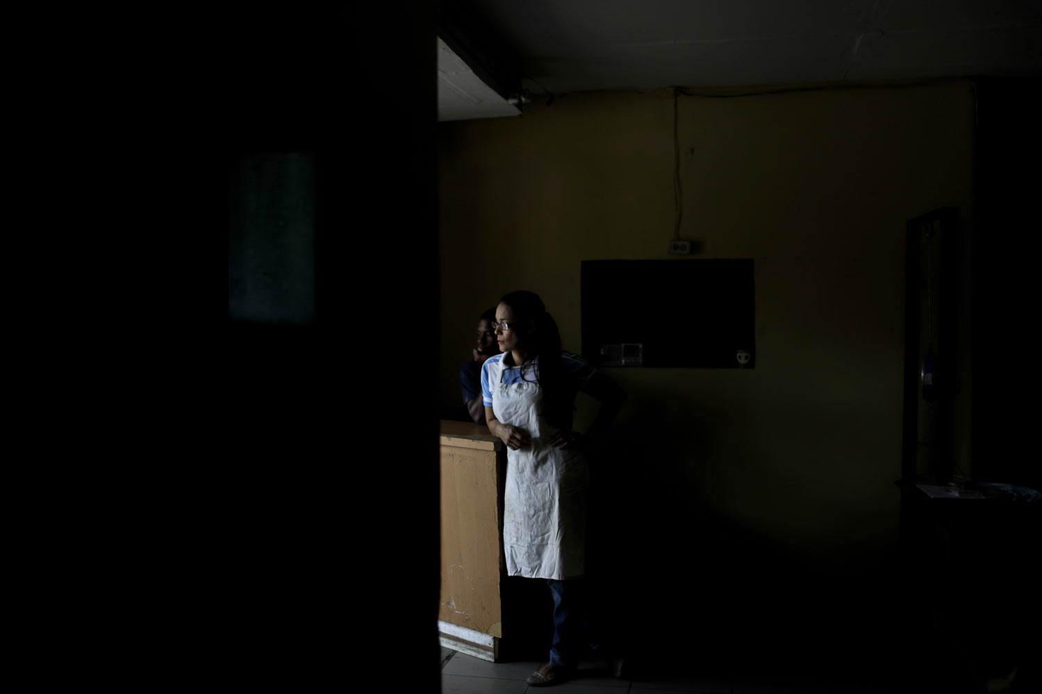  Estela Garcia stands inside the grocery store where she works in Caracas, Venezuela, Tuesday, March 26, 2019. Much of Venezuela remains without electricity as a new power outage spread across the country. (AP Photo/Natacha Pisarenko) 