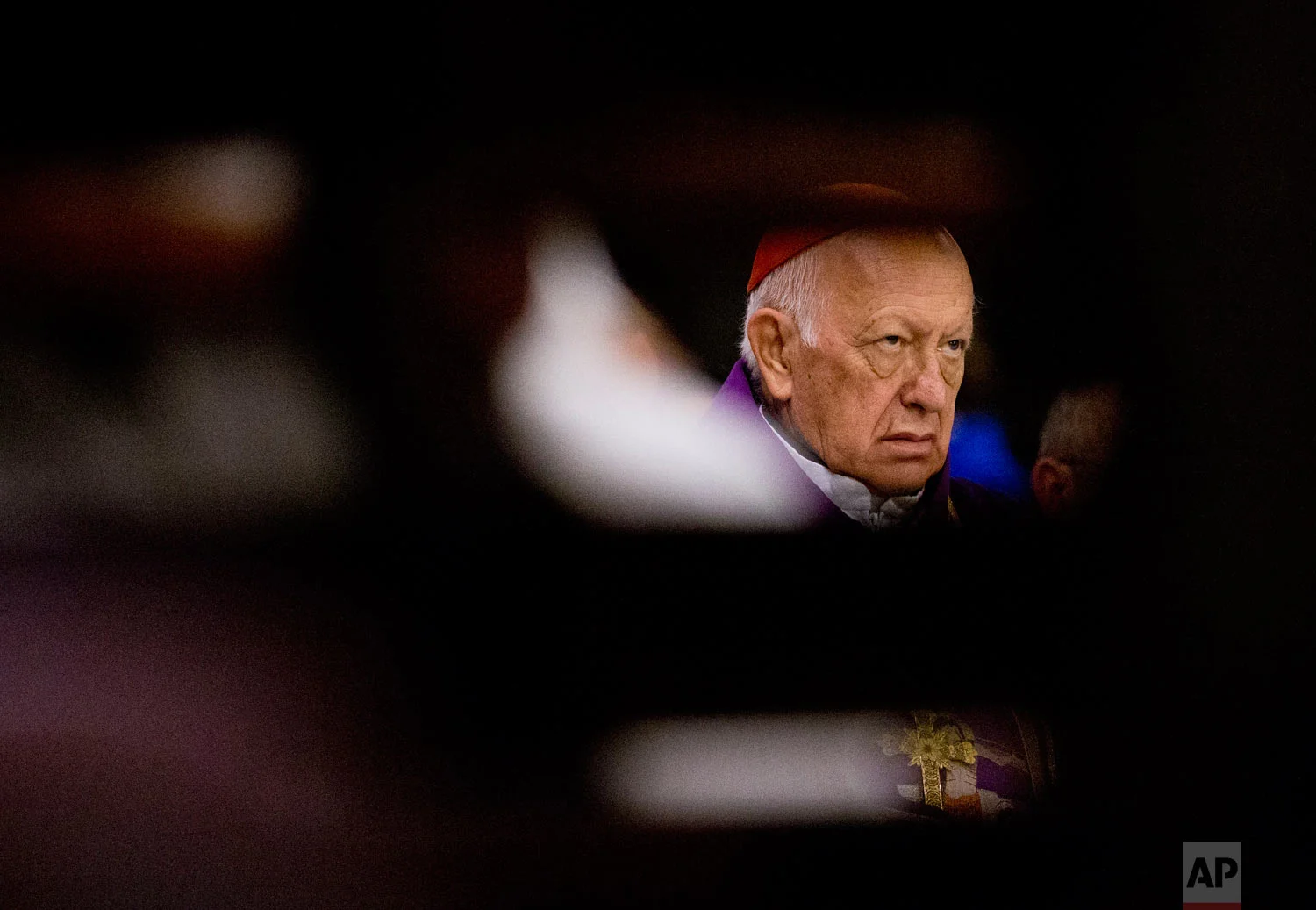 In this March 24, 2019 photo, former Archbishop of Santiago, Cardinal Ricardo Ezzati, takes part in a Mass at the Cathedral of Santiago, Chile, the day after Pope Francis replaced him as archbishop after he was placed under criminal investigation. (AP Photo/Esteban Felix)