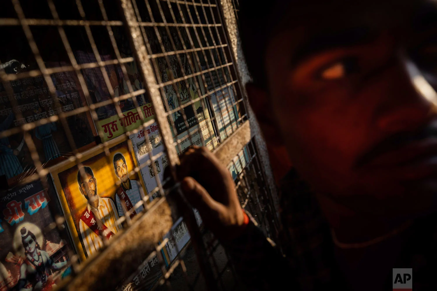 Hindu hardliners visit a memorial dedicated to the Kothari brothers and other Hindus killed during riots in Ayodhya, Uttar Pradesh, India, Nov. 25, 2018. (AP Photo/Bernat Armangue)