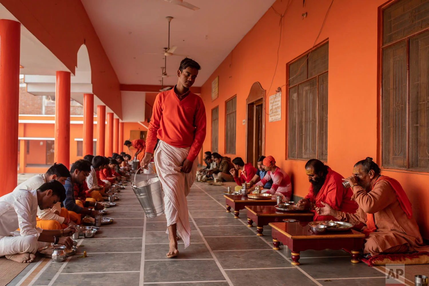 Hindu students of the Baghambari Math Gaddi have lunch in Prayagraj, India, Dec. 12, 2018. (AP Photo/Bernat Armangue)