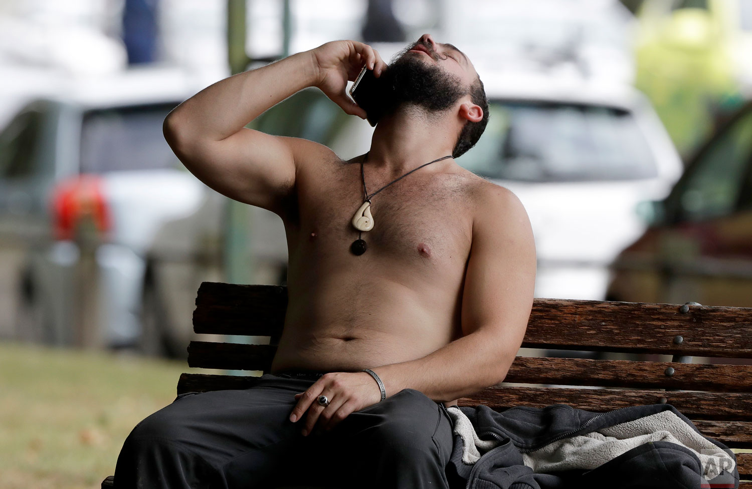  A man reacts as he speaks on a mobile phone outside a mosque following a shooting in central Christchurch, New Zealand, Friday, March 15, 2019. (AP Photo/Mark Baker) 