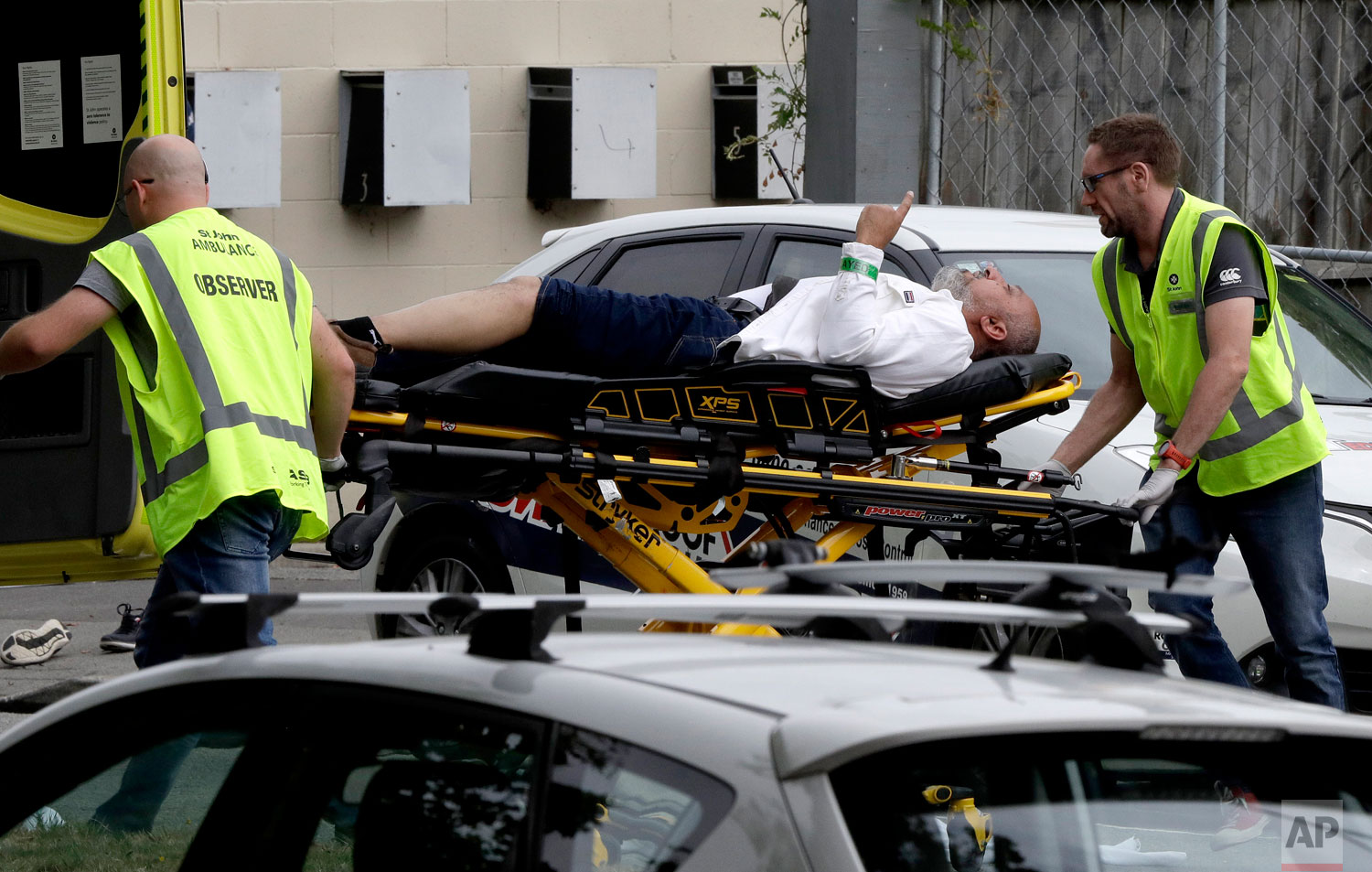  Ambulance staff take a man from outside a mosque in central Christchurch, New Zealand, Friday, March 15, 2019. (AP Photo/Mark Baker) 