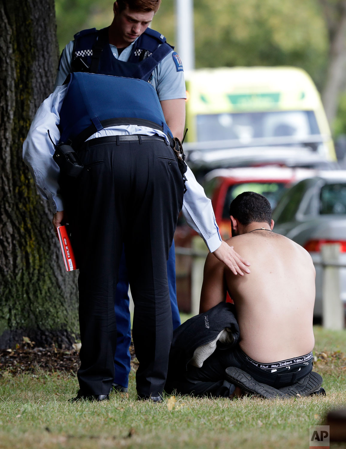  Police console a man outside a mosque in central Christchurch, New Zealand, Friday, March 15, 2019. (AP Photo/Mark Baker) 