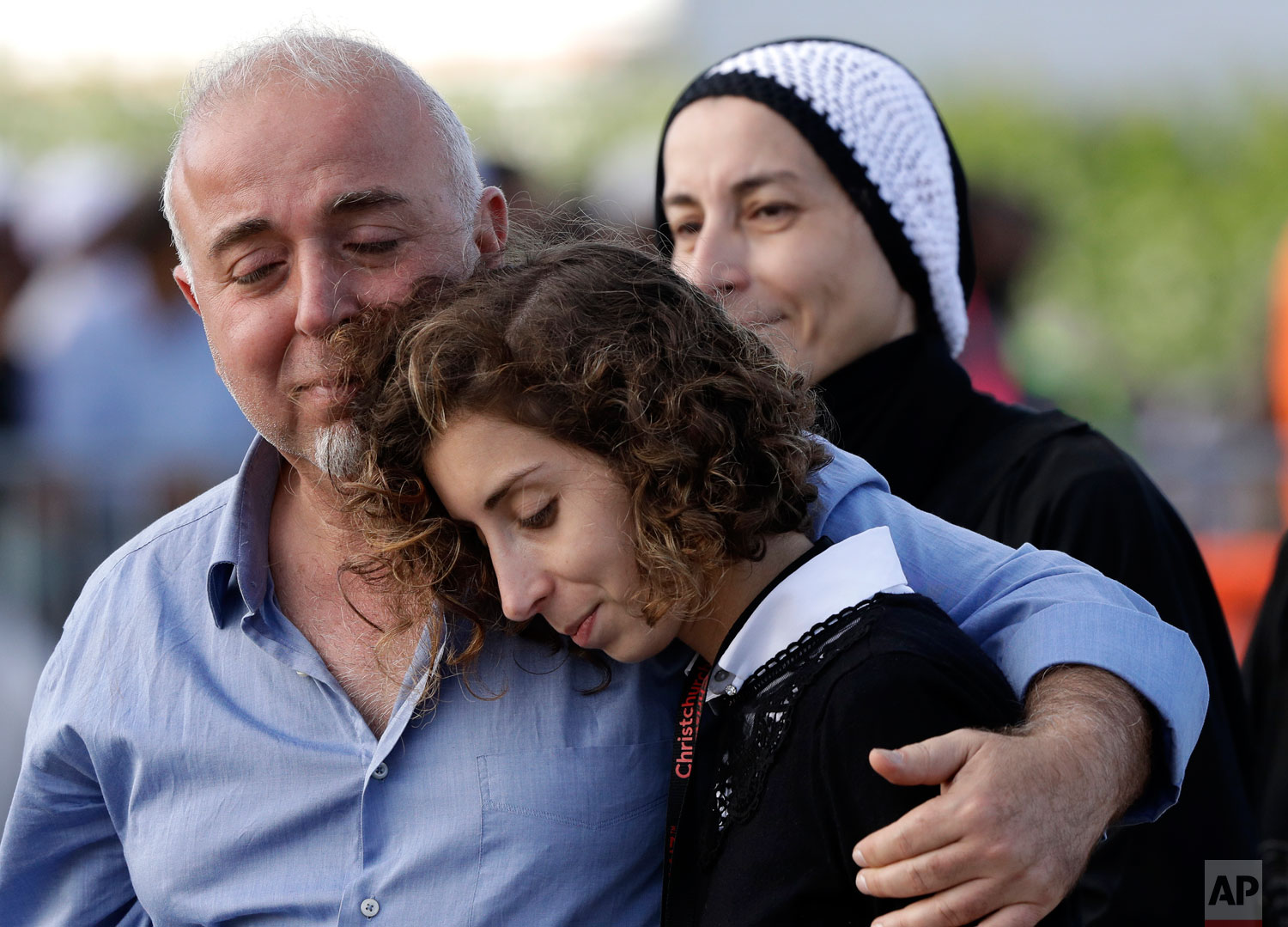  Mourners embrace following a burial ceremony at Memorial Park Cemetery in Christchurch, New Zealand, Friday, March 22, 2019.   (AP Photo/Mark Baker) 