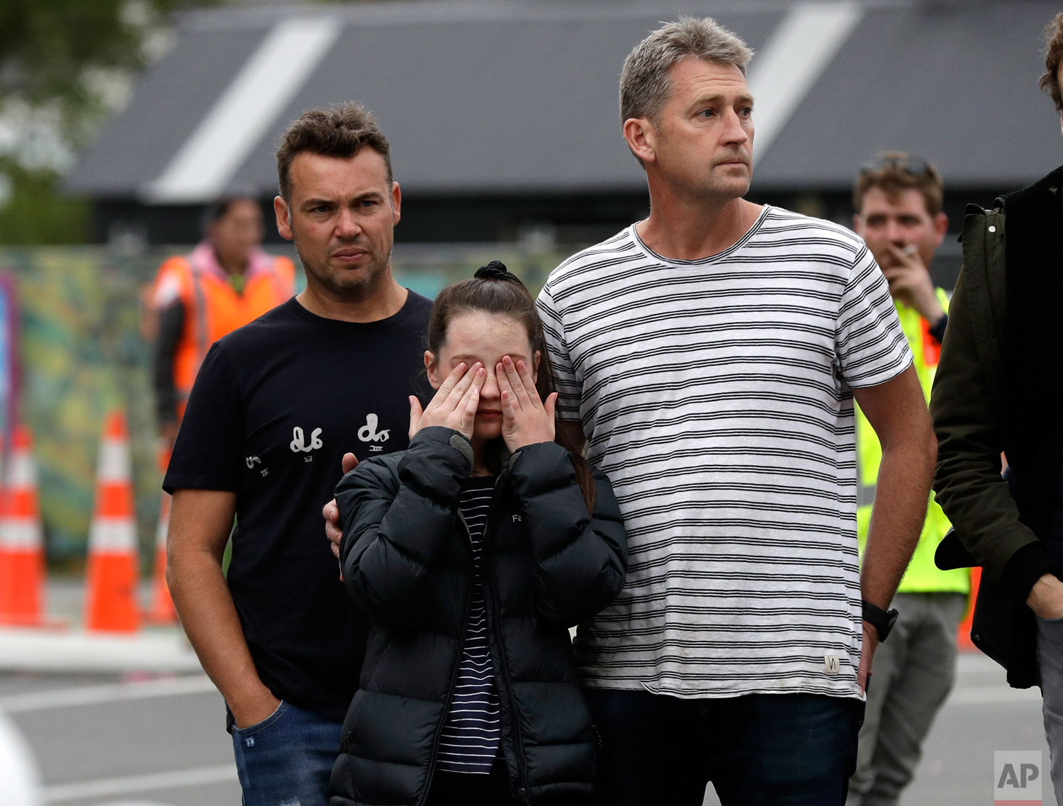 Mourners pay their respects at a makeshift memorial near the Masjid Al Noor mosque in Christchurch, New Zealand, Saturday, March 16, 2019. (AP Photo/Mark Baker)