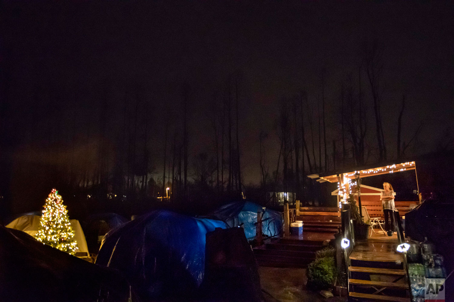  Diahnn "Shelly" Summers, right, looks out over the tents she set up in her backyard for  homeless Hurricane Michael evacuees in Youngstown, Fla, Wednesday, Jan. 23, 2019. "There is nowhere for them to go," Summers said. "When you don't have a home, 