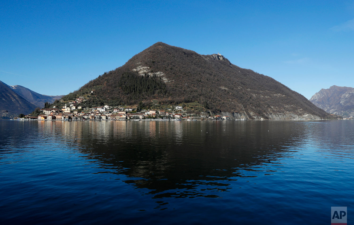  In this photo taken on Wednesday, Feb. 6, 2019, a view of Monte Isola, Lake Iseo, northern Italy. Step off the ferry onto Monte Isola and it feels like going back in time.  (AP Photo/Antonio Calanni) 