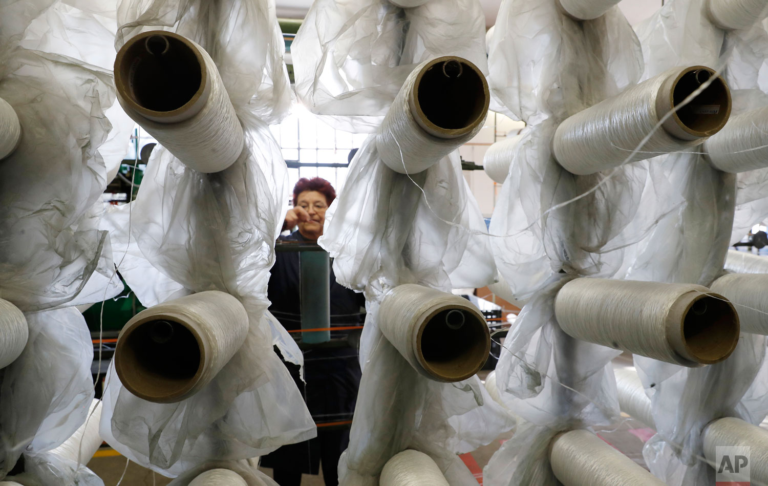  In this photo taken on Wednesday, Feb. 6, 2019, a woman works at "La Rete" (The Net) factory in Monte Isola, Lake Iseo, northern Italy.   (AP Photo/Antonio Calanni) 