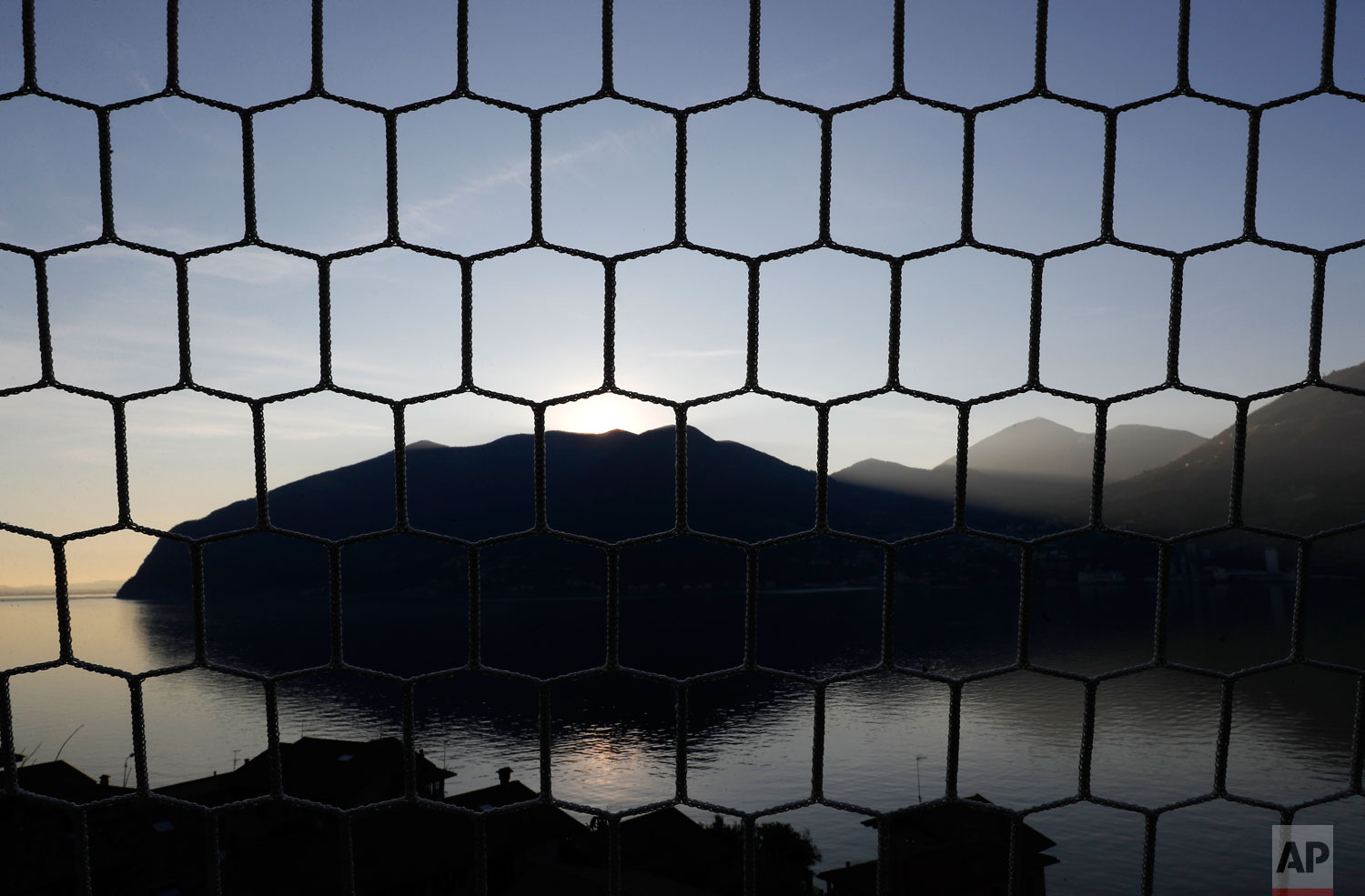  In this photo taken on Wednesday, Feb. 6, 2019, a view of Monte Isola, Lake Iseo, northern Italy.  (AP Photo/Antonio Calanni) 