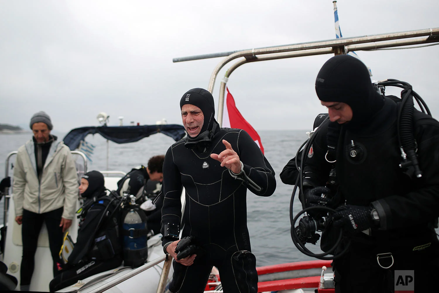 Lead archeologist for the project of opening wrecks to visitors Dimitris Kourkoumelis prepares to dive to a 5th Century B.C. shipwreck, near the coast of Peristera, Greece, April 7, 2019. (AP Photo/Petros Giannakouris)