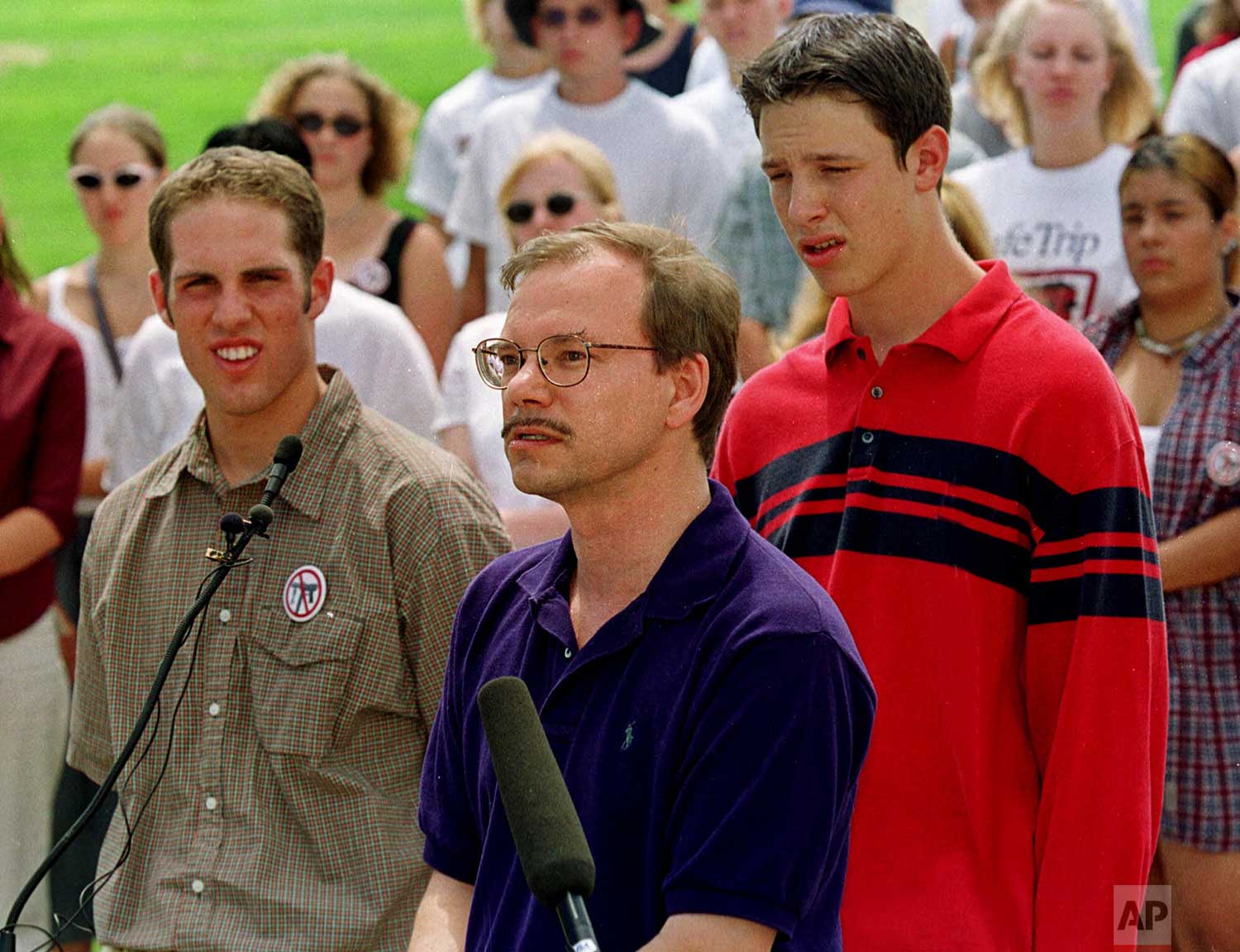  Tom Mauser, center, father of one of the students killed in the massacre in Columbine High School, joins David Winkler, left, and Ben Gelt, right, leaders of a student group called SAFE Colorado, at a news conference, Friday, July 30, 1999, west of 