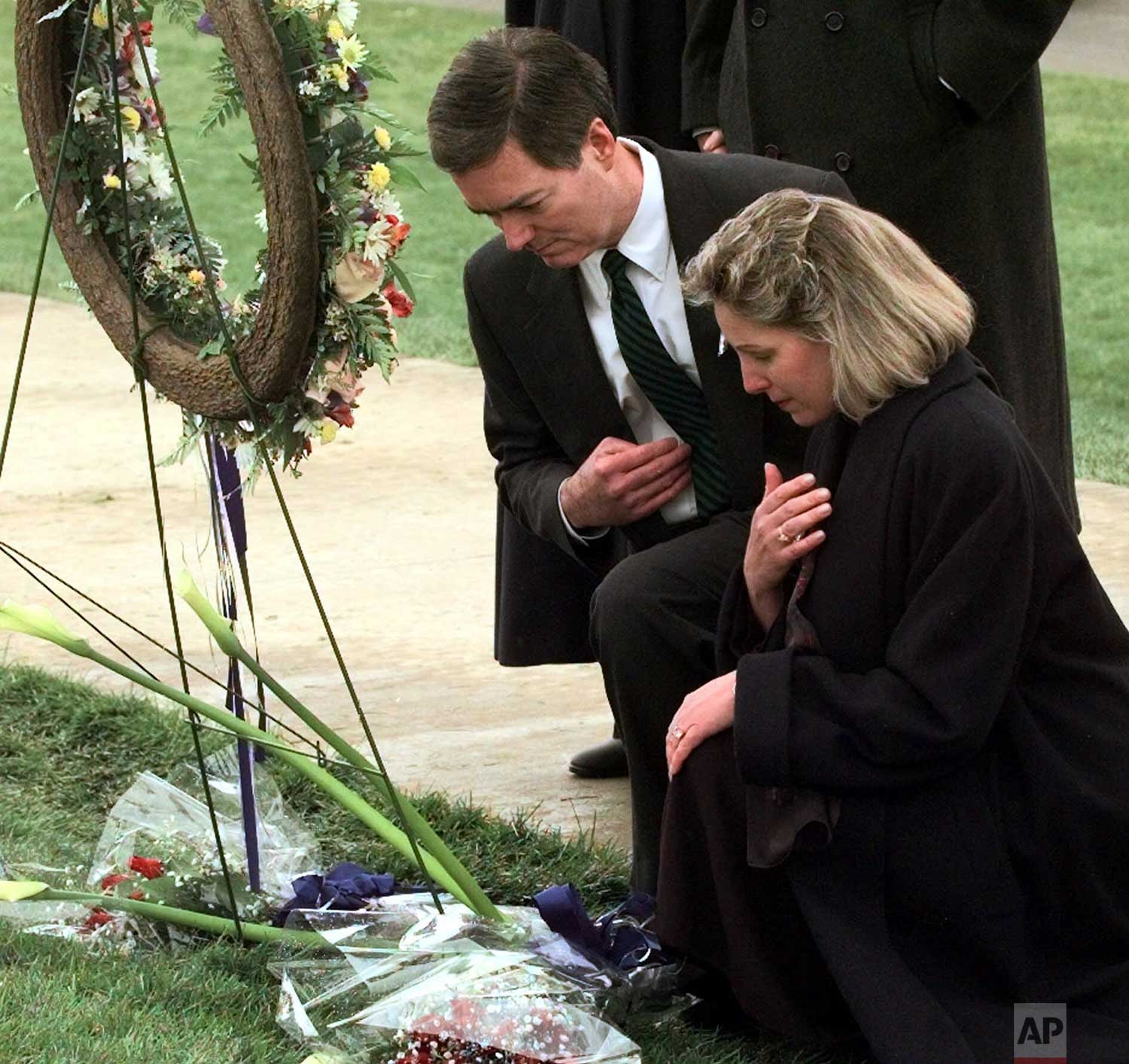  Colorado Governor Bill Owens and his wife Frances pay their respects at a memorial wreath after a community wide service in Littleton, Colo., Sunday, April 25, 1999 for the victims of the shooting spree at Columbine High School. (AP Photo/Laura Rauc
