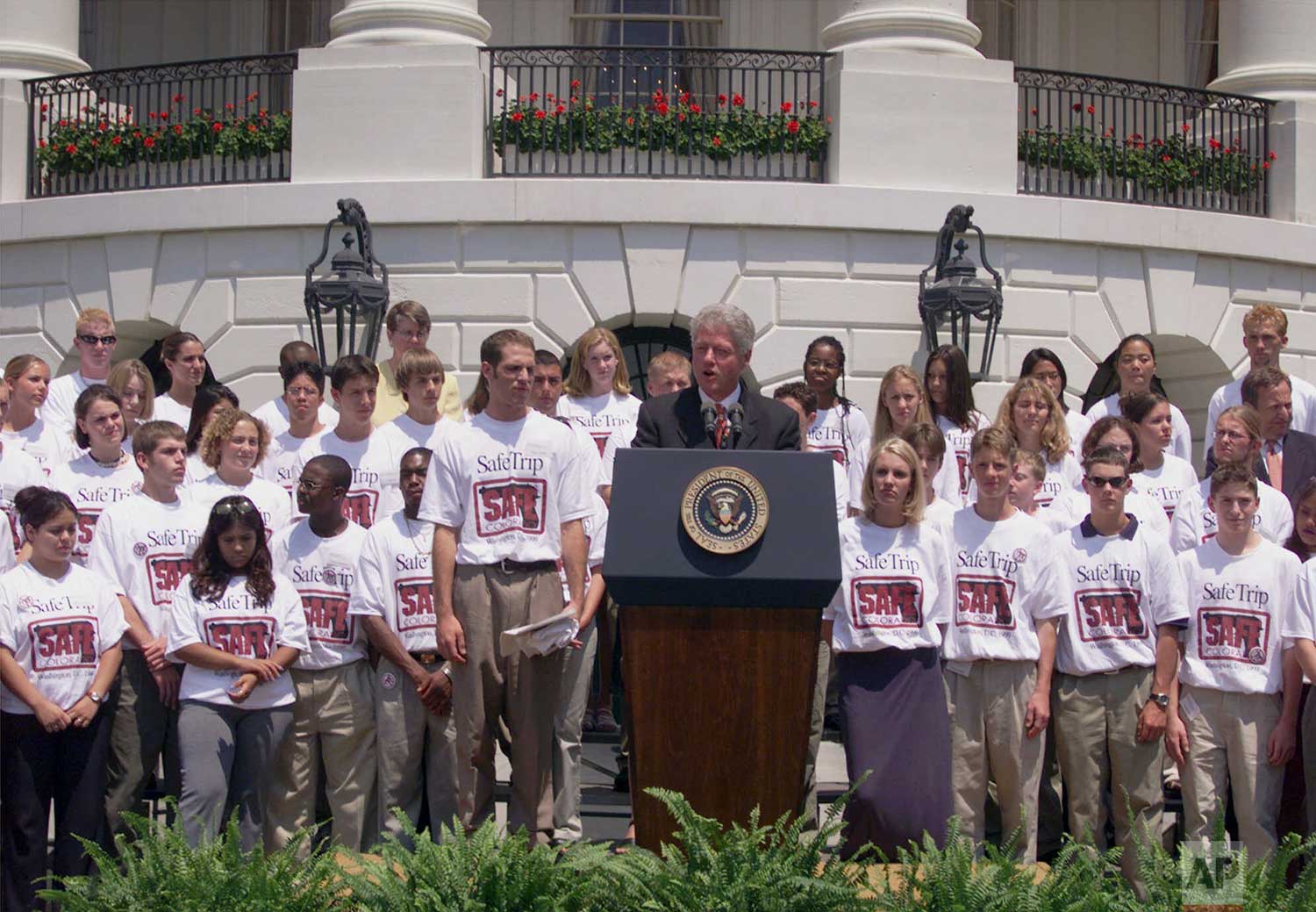  President Clinton is joined by students from Colorado's Columbine High School in an effort to urge Congress to pass gun control legislation during a ceremony on the South Lawn of the White House, Thursday  July 15, 1999. (AP Photo/Susan Walsh) 