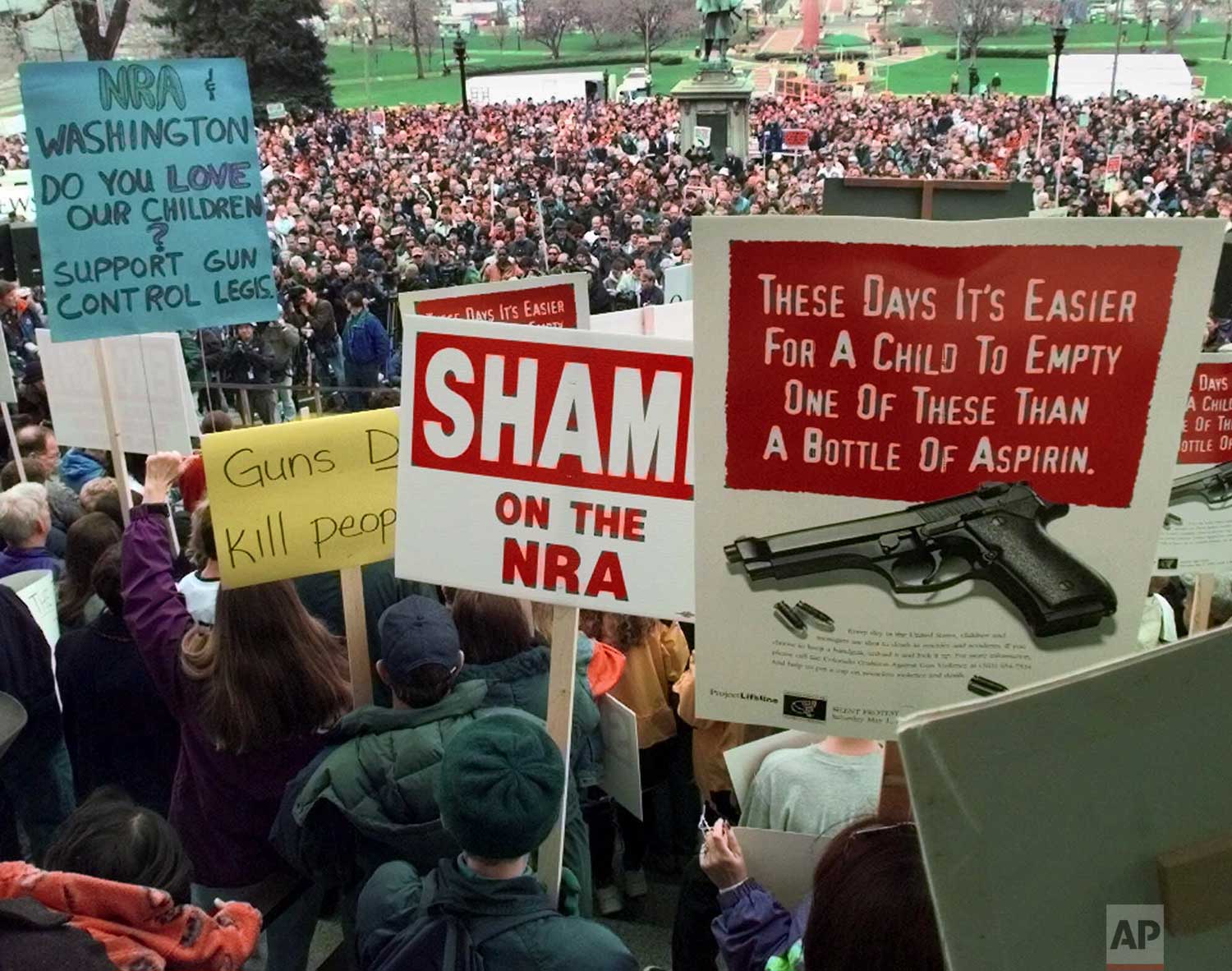  Demonstrators gather on the Colorado State Capitol grounds in Denver, Colo., on Saturday, May 1, 1999, to protest against the National Rifle Association's annual meeting, which is being held in the city. The convention was planned long before the re