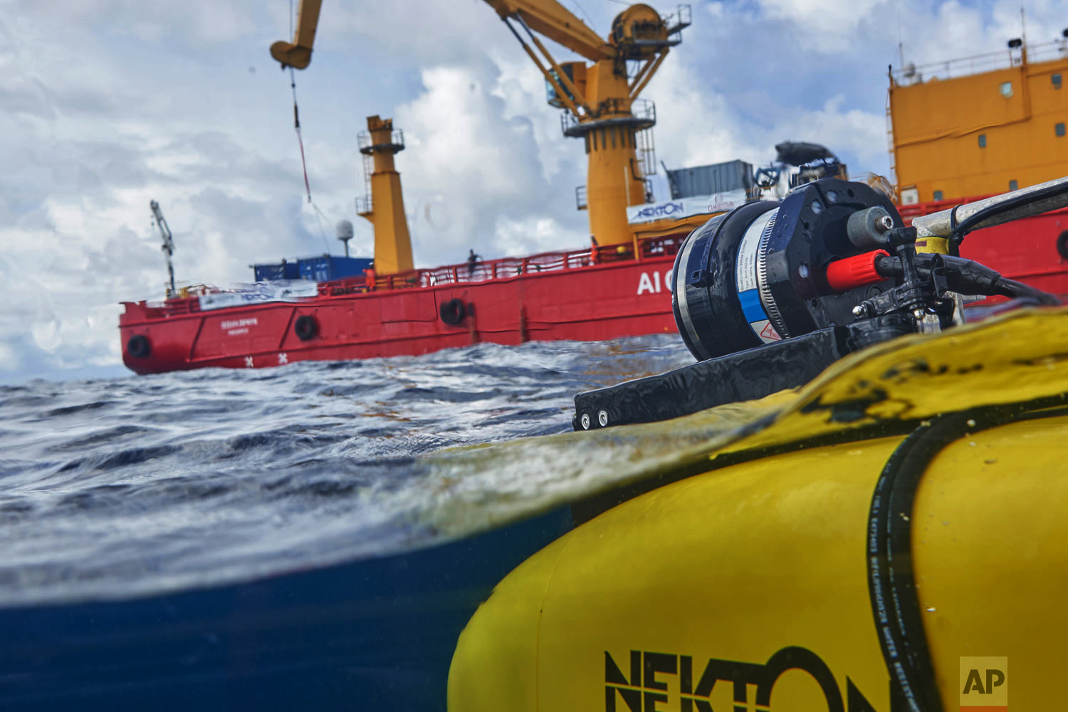 A manned submersible emerges from the water after a dive off the coast of the island of St. Joseph in the Seychelles, April 8, 2019. (AP Photo/David Keyton)