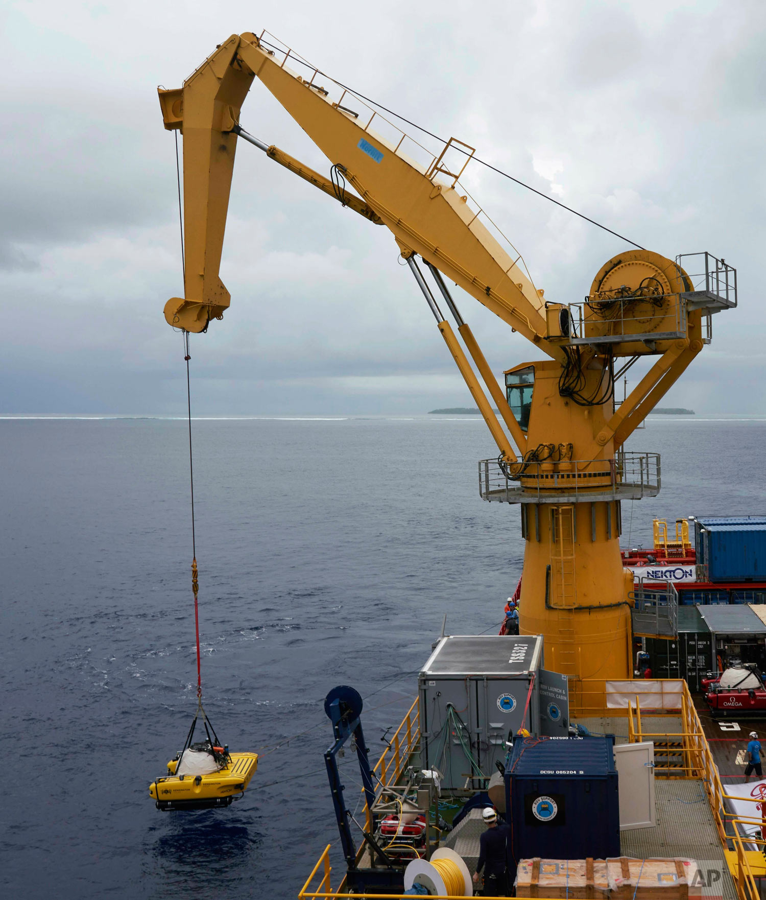 The British-led Nekton Mission lowers a submersible into the waters of the Indian Ocean off the Seychelles islands, during extensive tests March 7, 2019. ( (AP Photo/David Keyton)