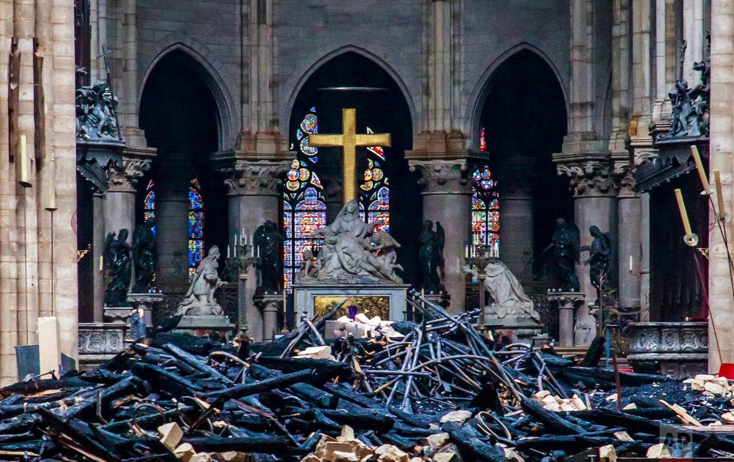 Debris covers the floor of the Notre Dame Cathedral in Paris, April 16, 2019. (Christophe Petit Tesson/Pool Photo via AP)
