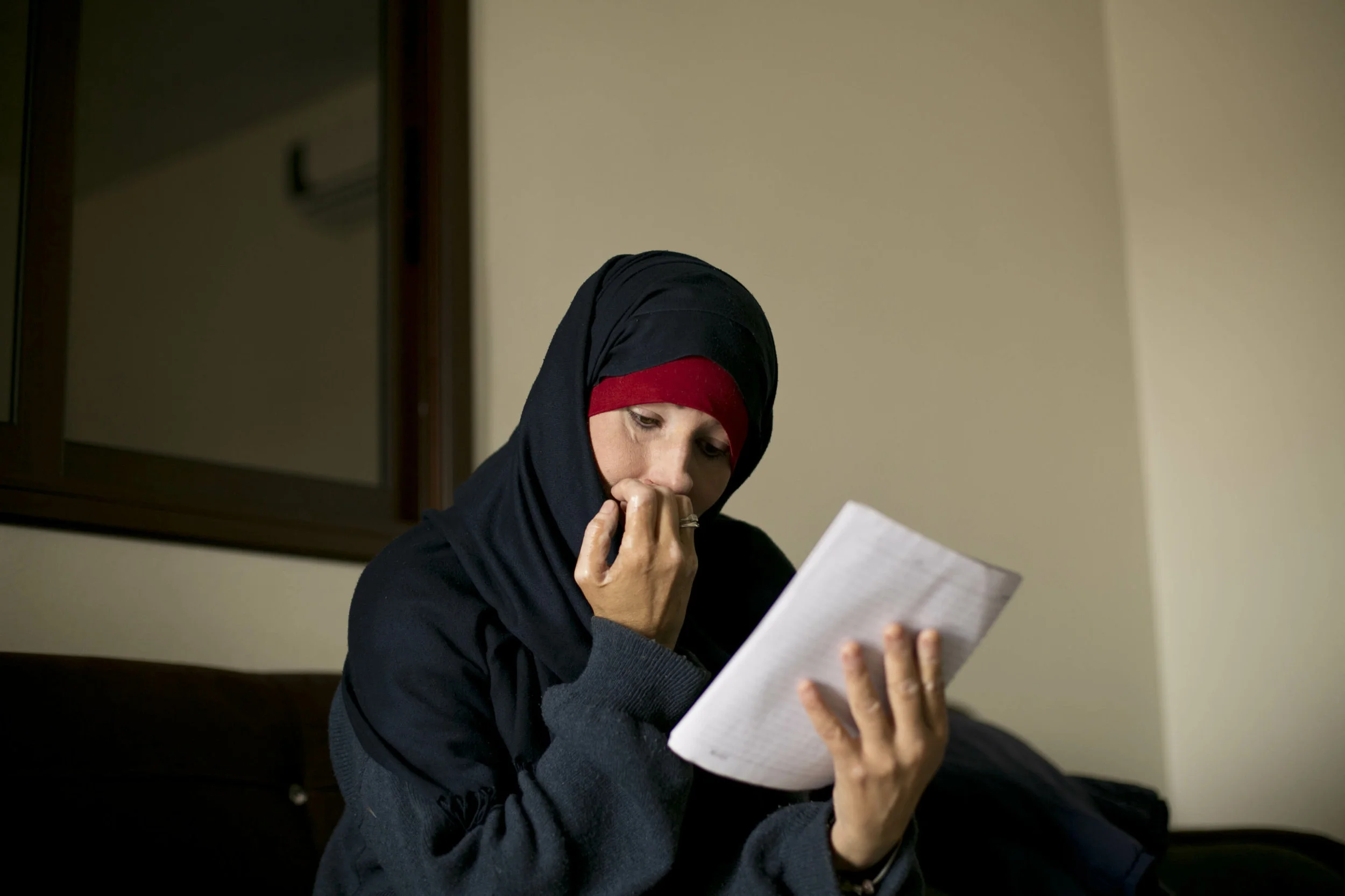 Kimberly Gwen Polman, a Canadian national, reads a letter she wrote to her countrymen at camp Roj in Syria on April 3, 2019. Polman followed her husband to Raqqa, Syria, the Islamic State group’s capital at the time. (AP Photo/Maya Alleruzzo)