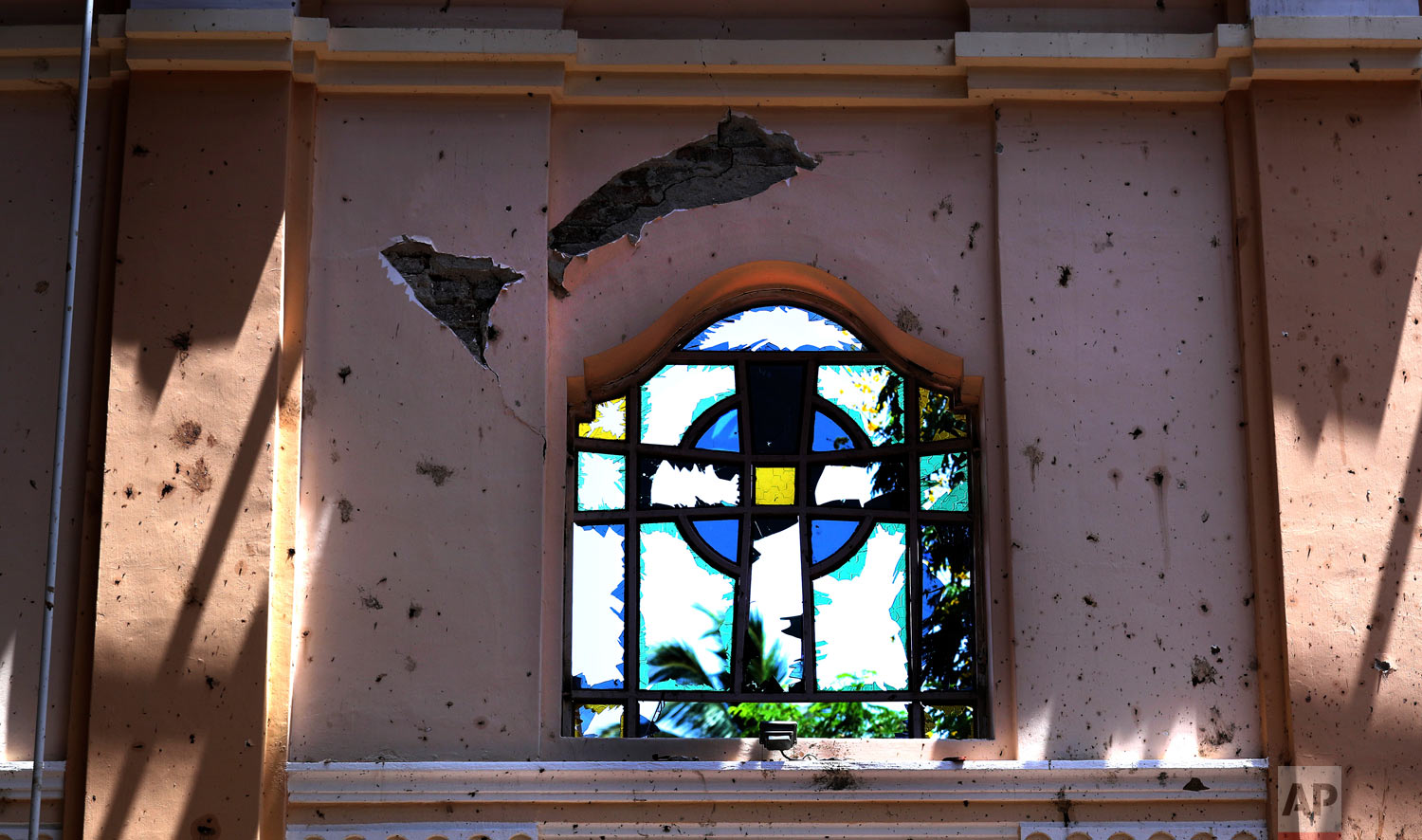 A stained-glass window stands broken at Sebastian's Church, in Negombo, Sri Lanka, April 25, 2019. (AP Photo/Manish Swarup)